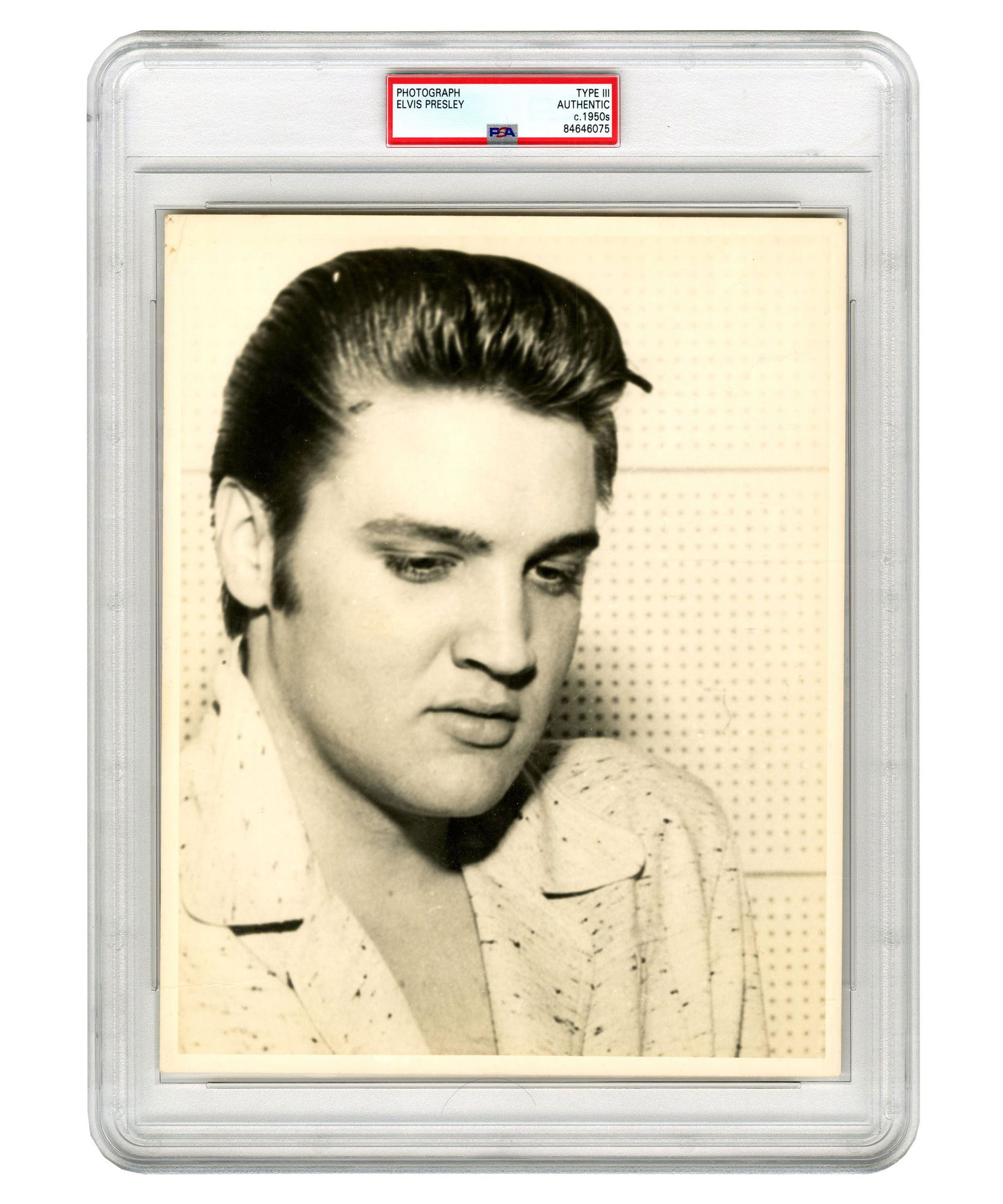 Pensive & Soulful Looking Elvis Presley PSA Type III Photo (ca.1950s): Pensive & Soulful Looking Elvis Presley PSA Type III Photo (ca.1950s) Black and white photograph, measuring 8" x 10", n.p., n.d. [ca. 1950s]. A pensive-looking Elvis Presley, wearing a V-neck whit
