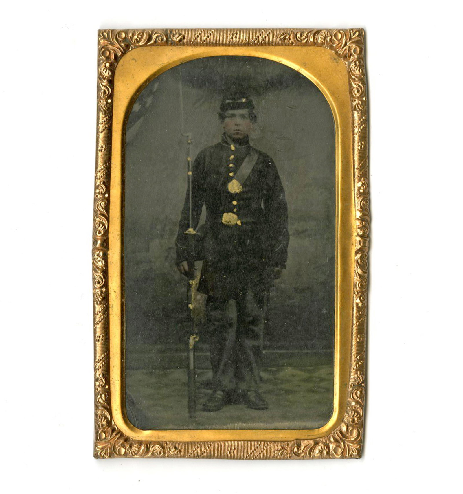 Youthful Union Soldier Tintype: Youthful Union Soldier Tintype An attractive tintype of a young Union soldier. Measuring 3.5" x 2.25", n.p., n.d. A studio portrait of a young male dressed in his Union uniform, including a forage cap