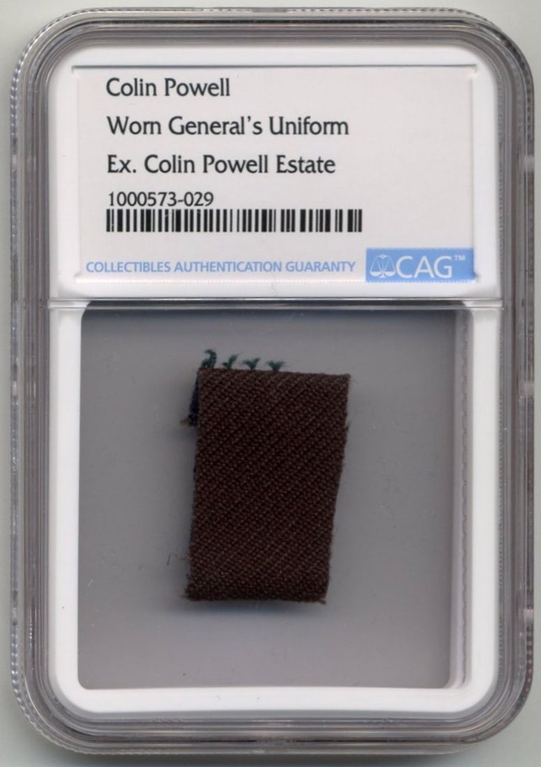 Colin Powell's Worn General Uniform. Ex. Colin Powell Estate.: Colin Powell's Worn General Uniform. Ex. Colin Powell Estate. Swatch, 1.125" x 1", from the uniform of one of the most decorated Generals in our country's history. Encapsulated by CAG to a size of 2.3