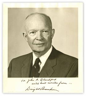 Dwight D. Eisenhower Boldy Signed Photo w/ Beckett Cert: Dwight D. Eisenhower Boldy Signed Photo w/ Beckett Cert A signed portrait photo depicting 34th President Dwight Eisenhower, inscribed to naval Colonel John R. Blandford (1919-2000). 1p, measuring 8"