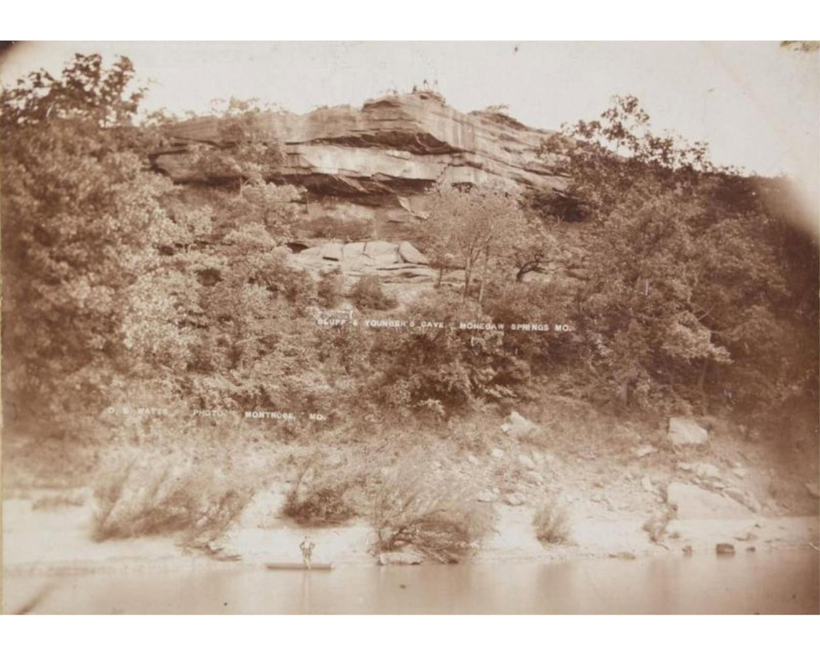Younger Gang's Cave: An Early Mounted Photo of The Younger Hideout in the Osage tribal lands: James Younger Gang Monegaw Springs, MO, n.d. Younger's Cave: An Early Mounted Photo of The Younger Hideout in the Osage tribal lands An Early Mounted Photo of the hideout of the James–Younger Gang, 