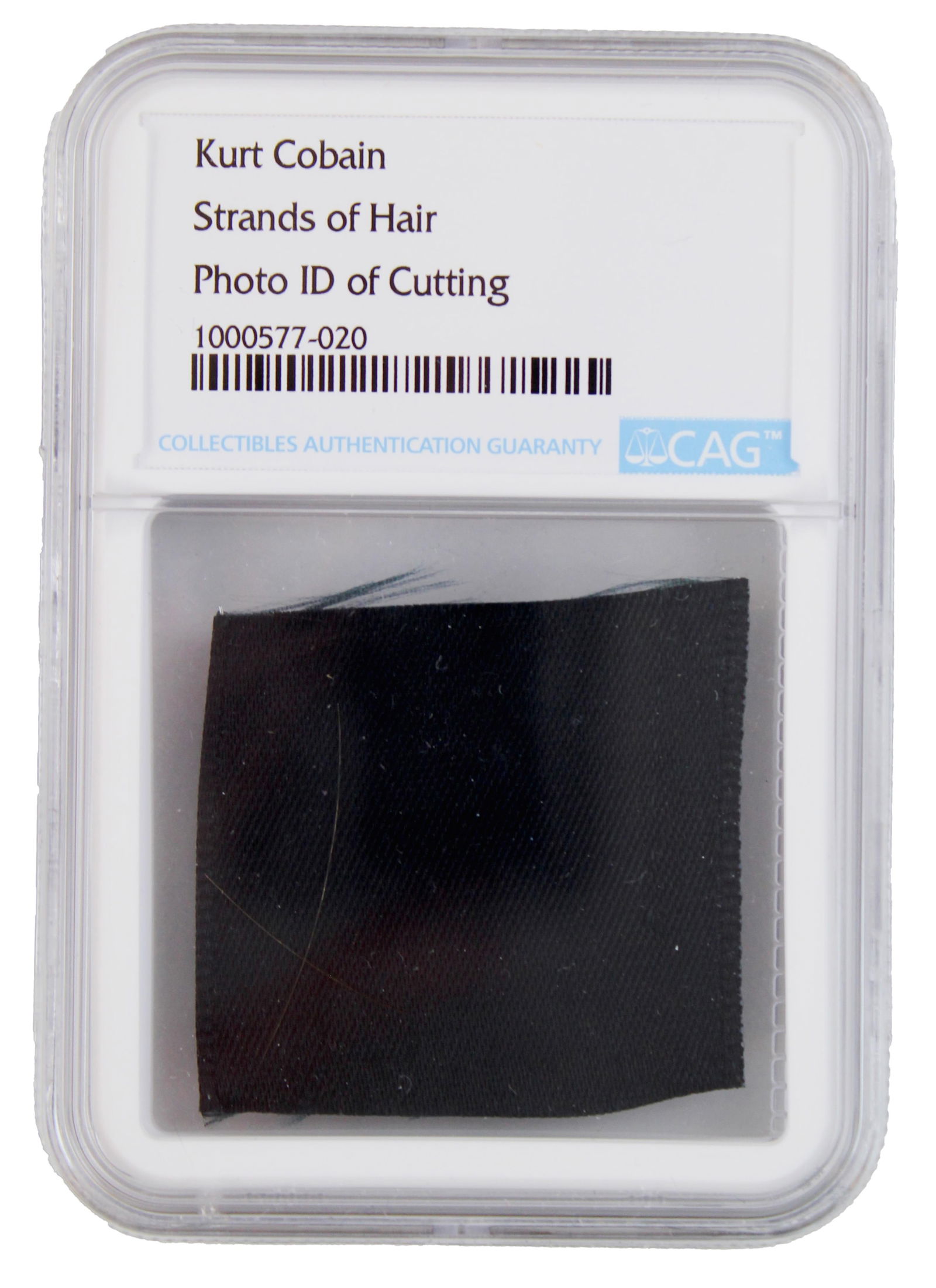 Kurt Cobain Strands of Hair, Collected by his Stylist, CAG Encapsulated: Kurt CobainBirmingham, England, October 29, 1989Kurt Cobain Strands of Hair, Collected by his Stylist, CAG EncapsulatedRelicTwo strands of Kurt Cobain's hair, taken from Cobain during the "Bleach" tou