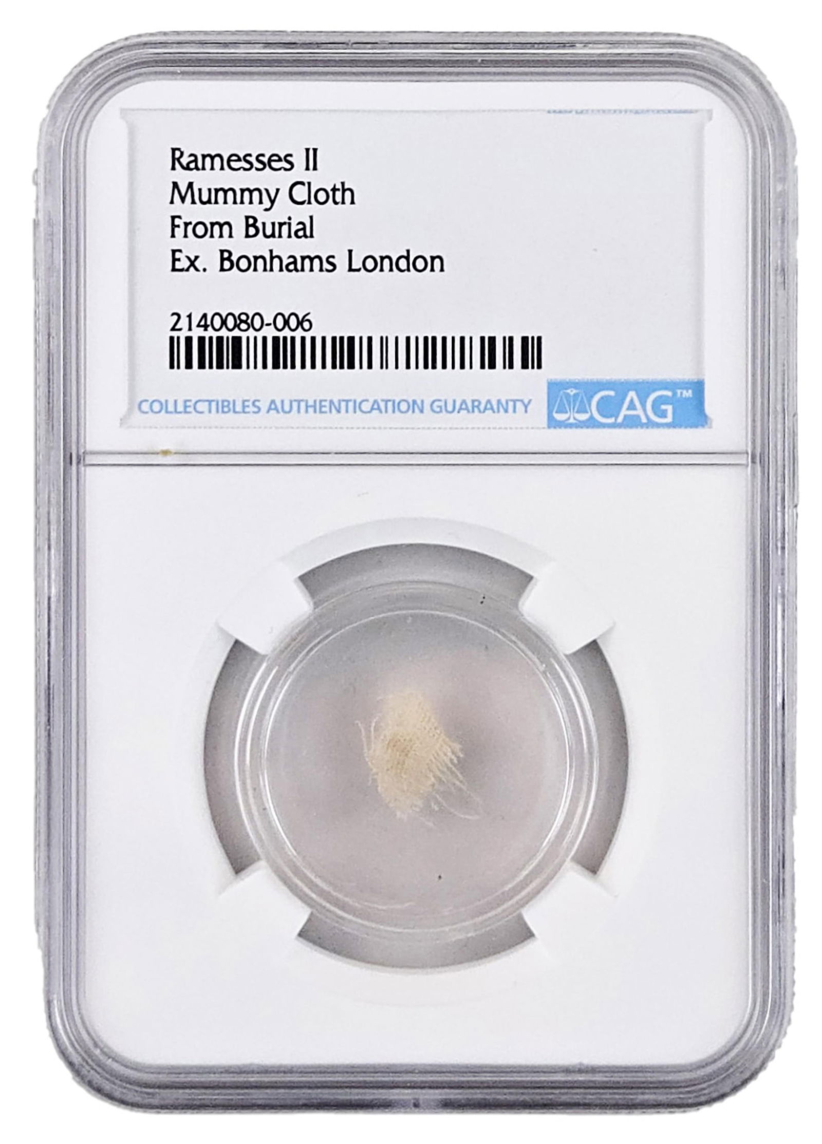 Ramesses the Great Piece of Burial Cloth, Ca. 1213 BC- Ex. Bonhams London: Ancient EgyptEgypt, ca. 1213 BCRamesses the Great Piece of Burial Cloth, Ca. 1213 BC- Ex. Bonhams LondonRelicA .3/8" piece of burial cloth excavated from the mummy of Ramesses II, commonly referred to