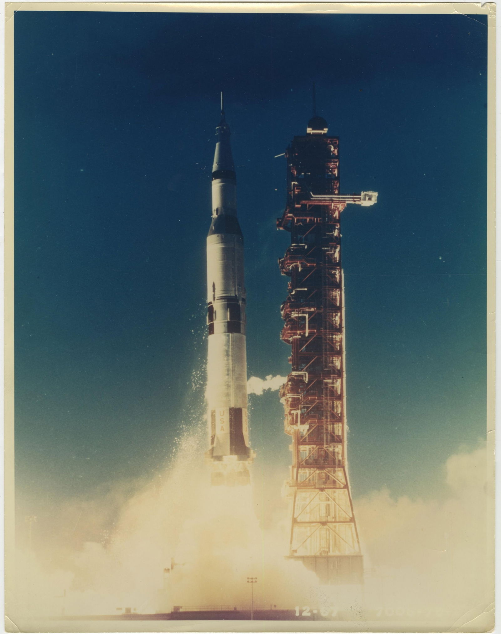 Large Saturn V Launch Type I Photo with PSA LOA: Saturn V n.p., ca. 1967 Large Saturn V Launch Type I Photo with PSA LOA Photograph Extra-large color Type I photo of the Saturn V launch. Photo measures 11" x 14" and is printed on Kodak photopaper.