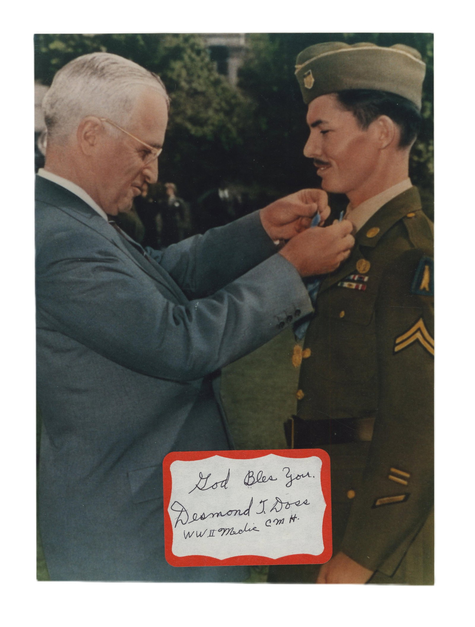 WWII Medic Desmond Doss Signed Photo of Truman Presenting Him With Medal of Honor: Desmond Doss n.p., n.d. WWII Medic Desmond Doss Signed Photo of Truman Presenting Him With Medal of Honor Signed photograph Desmond Doss (1919-2006). Color photograph of President Harry Truman present
