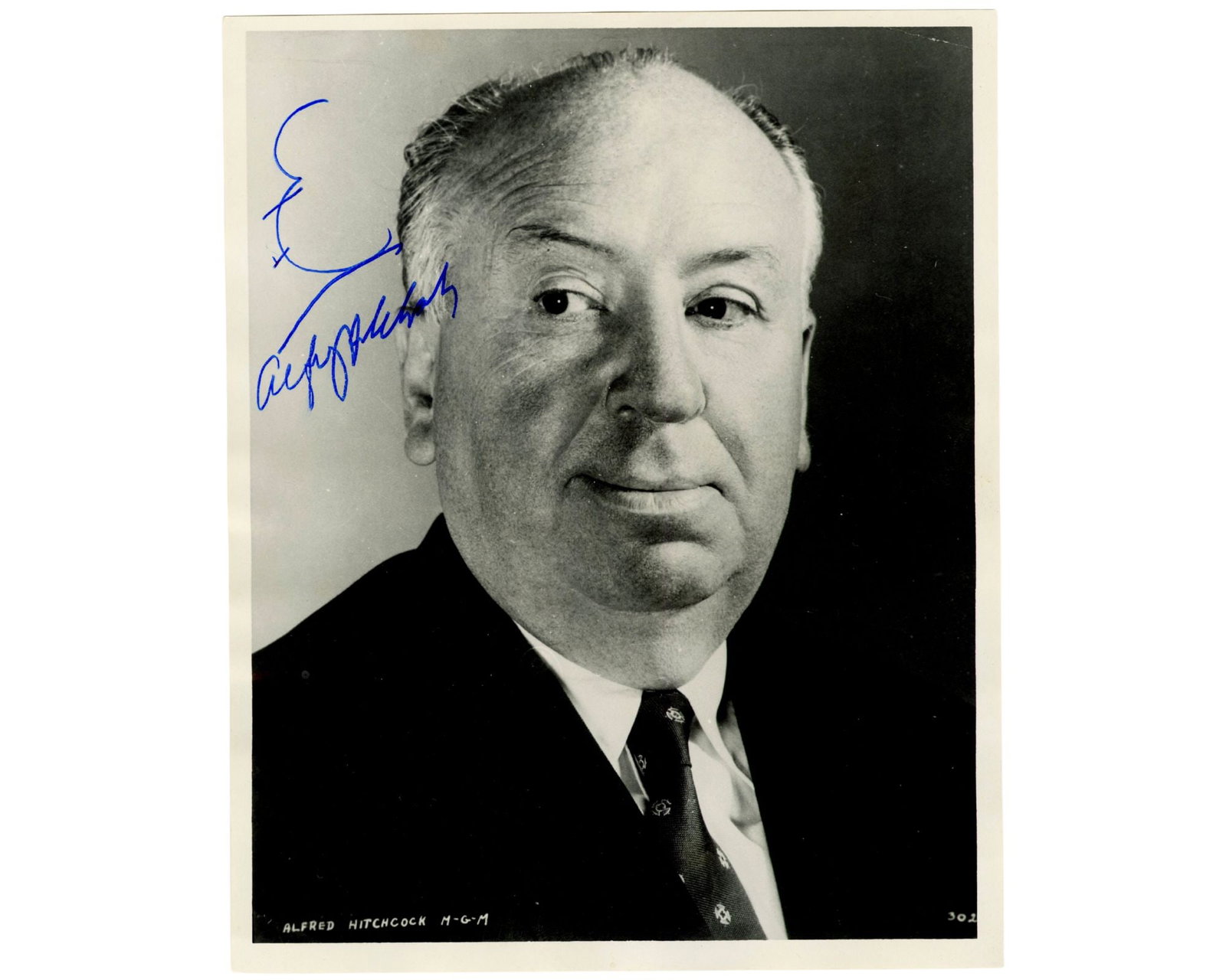Alfred Hitchcock Sketches and Signs Profile Classic Photograph of Mysterious Pose! PSA LOA.: Alfred Hitchcock n.p., n.d. Alfred Hitchcock Sketches and Signs Profile Classic Photograph of Mysterious Pose! PSA LOA. Signed photograph Original glossy MGM publicity photograph featuring legendary