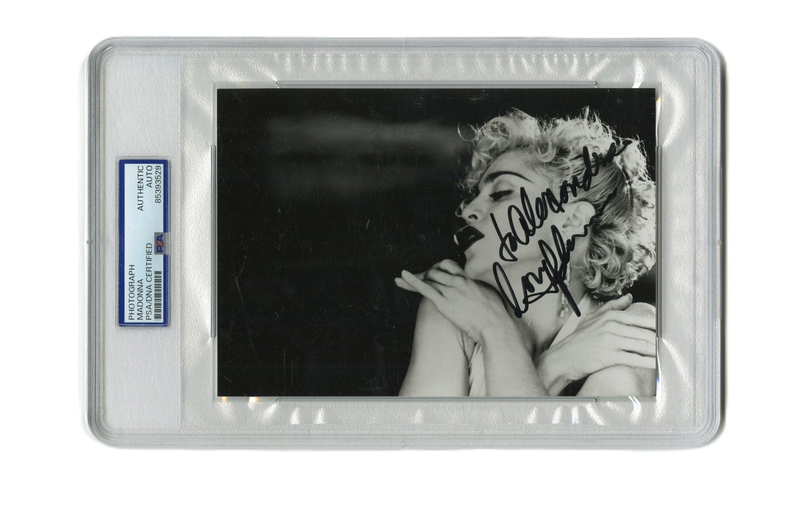 Madonna Boldly Signed Photo, PSA Slabbed: Madonna n.p., ca. 1985 Madonna Boldly Signed Photo, PSA Slabbed Signed photograph Madonna Ciccone (b. 1958). Black and white promotional photo of Madonna, circa 1985, inscribed and signed, "to Alexand