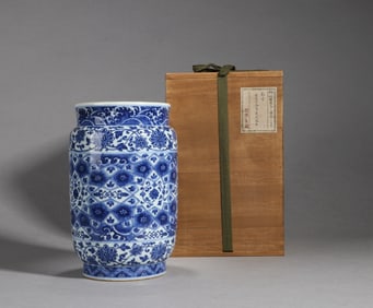 A blue and white floral jar
