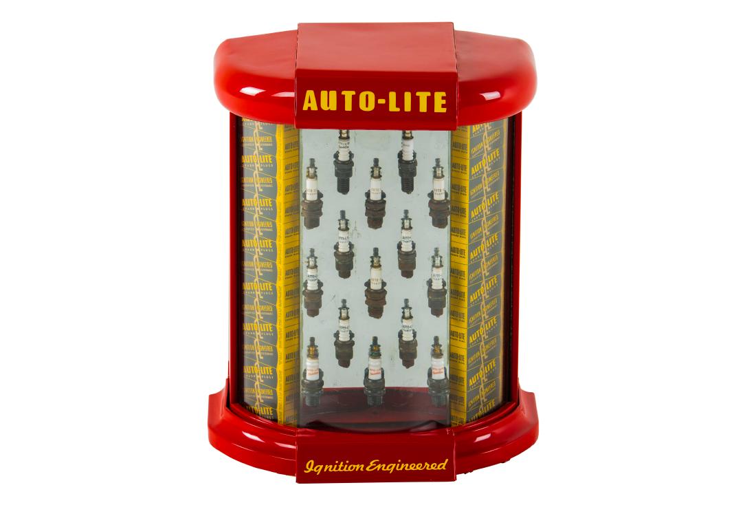 Auto-Lite Spark Plug Counter Display: It shows light wear and a few bends/dents throughout. It displays very well with all of the spark plugs. Measures: 18.75"x14.5"x10" Rating: Restored Est: $500-$1000