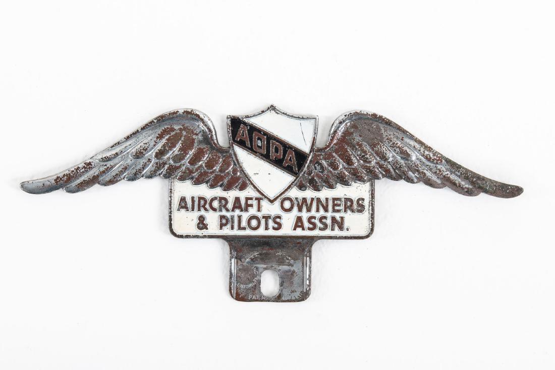 Aircraft Owners & Pilots License Plate Topper: SST. Good color. Shows areas that has plating loss. Very tough topper to find. Measures: 3"X8" Rating: 7.25 Est: $250-$400