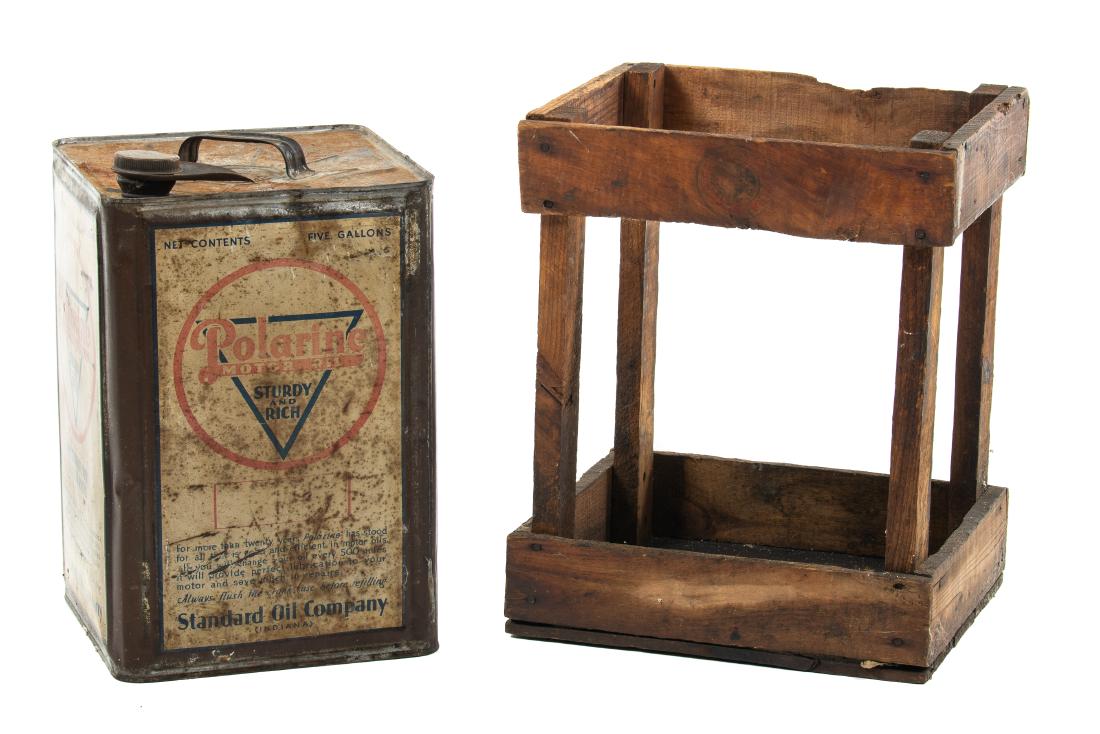Polarine 5 Gallon Oil Can In Crate: It has fair color. It shows paint loss, discoloration, wear, and a few bends/dents throughout. It displays fair. Measures: 15.25"x10.5"x12.5" Rating: 6 Est: $75-$150