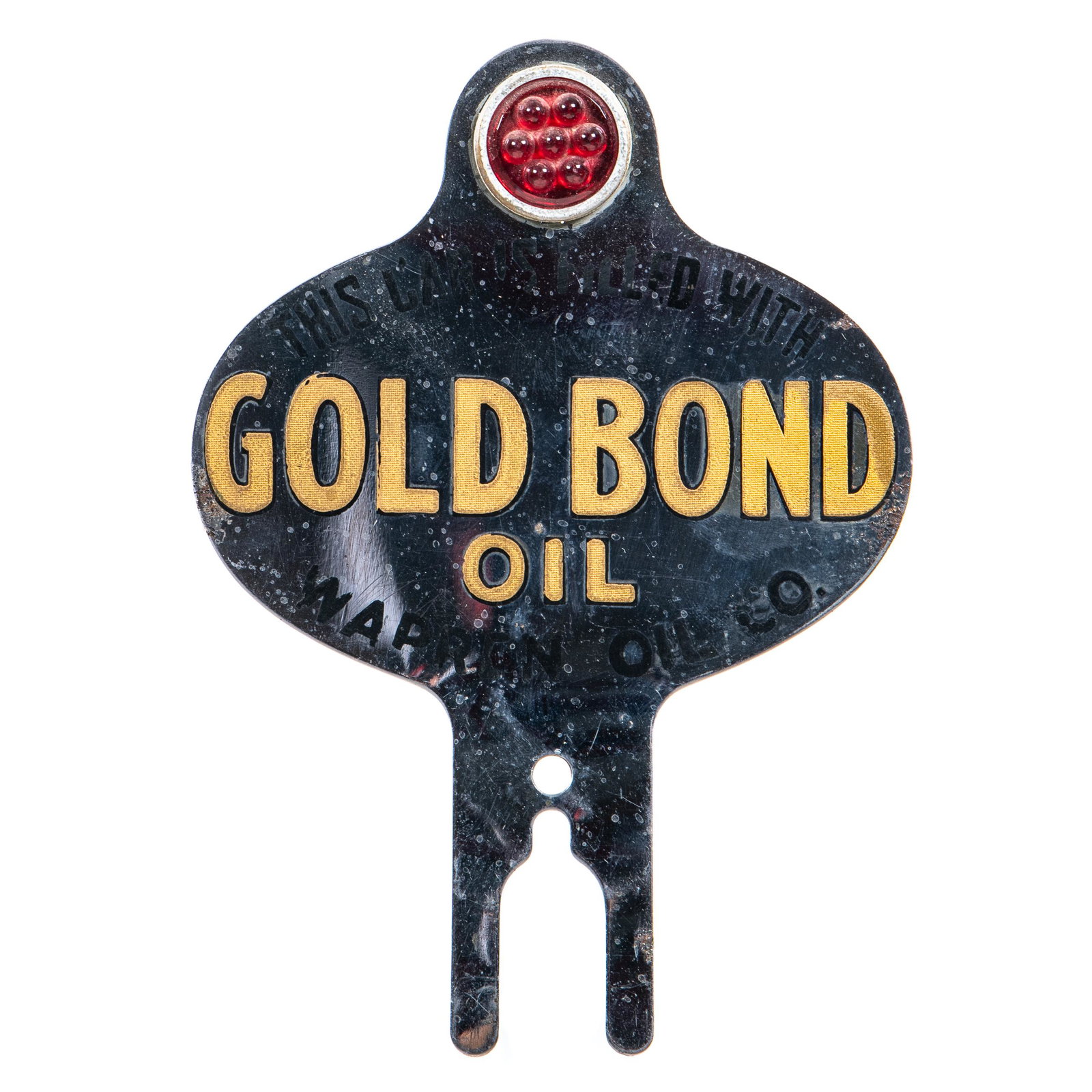 Rare Warren Gold Bond Oil License Plate Topper: SST. with reflective jewel. The plating shows scratching and rust. The reflective letters show paint loss as well. Very tough topper to find. Measures: 6.75"X4.75" Rating: 8 Est: $150-$300