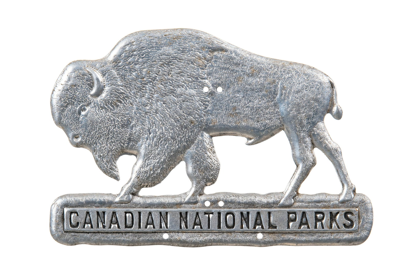 Canadian National Parks License plate Topper: Aluminum license plate topper. Non painted. Nice die cut graphic of a bison. Minor wear throughout. Measures: 4.25"X3" Rating: 8 Est: $50-$100