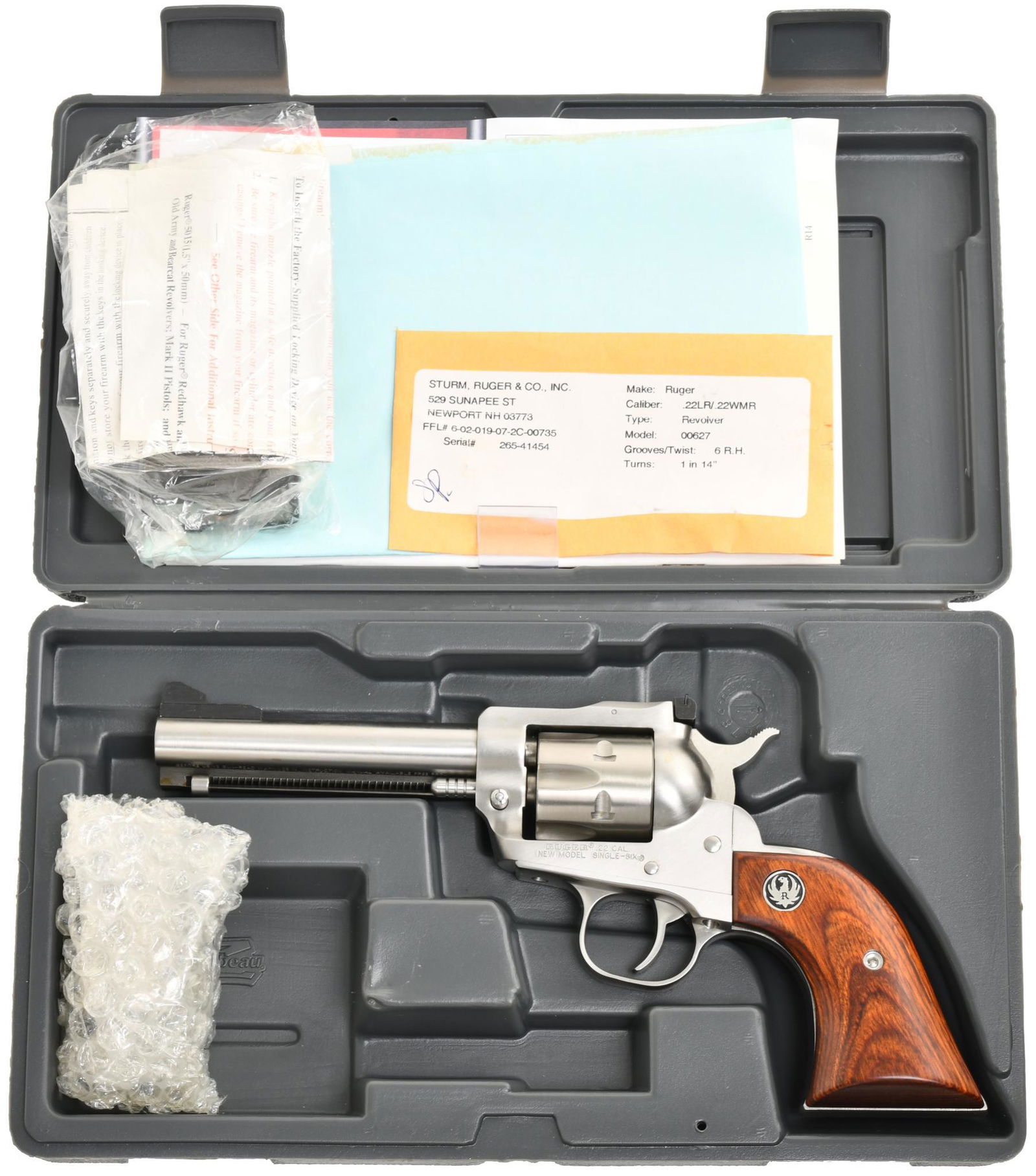Ruger New Model Single Six .22 Caliber Single Action: 4 5/8" Barrel. 6 shot. Stainless steel. Comes w/ long rifle and magnum cylinders. New in box w/ papers. .