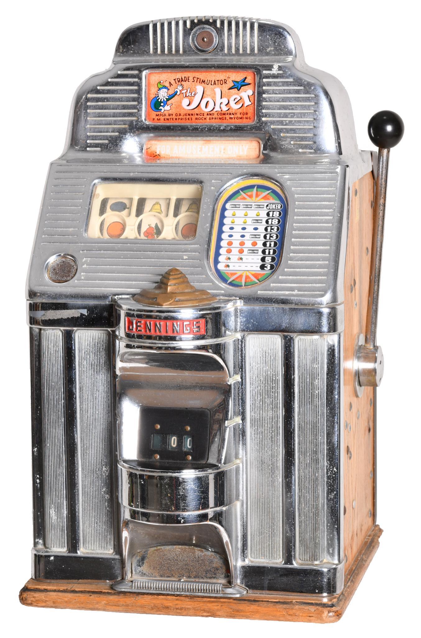 Jennings "The Joker" Slot Machine: For amusement only, no key, the wooden base has damage, missing lock mech, 27.5"x16"x15"