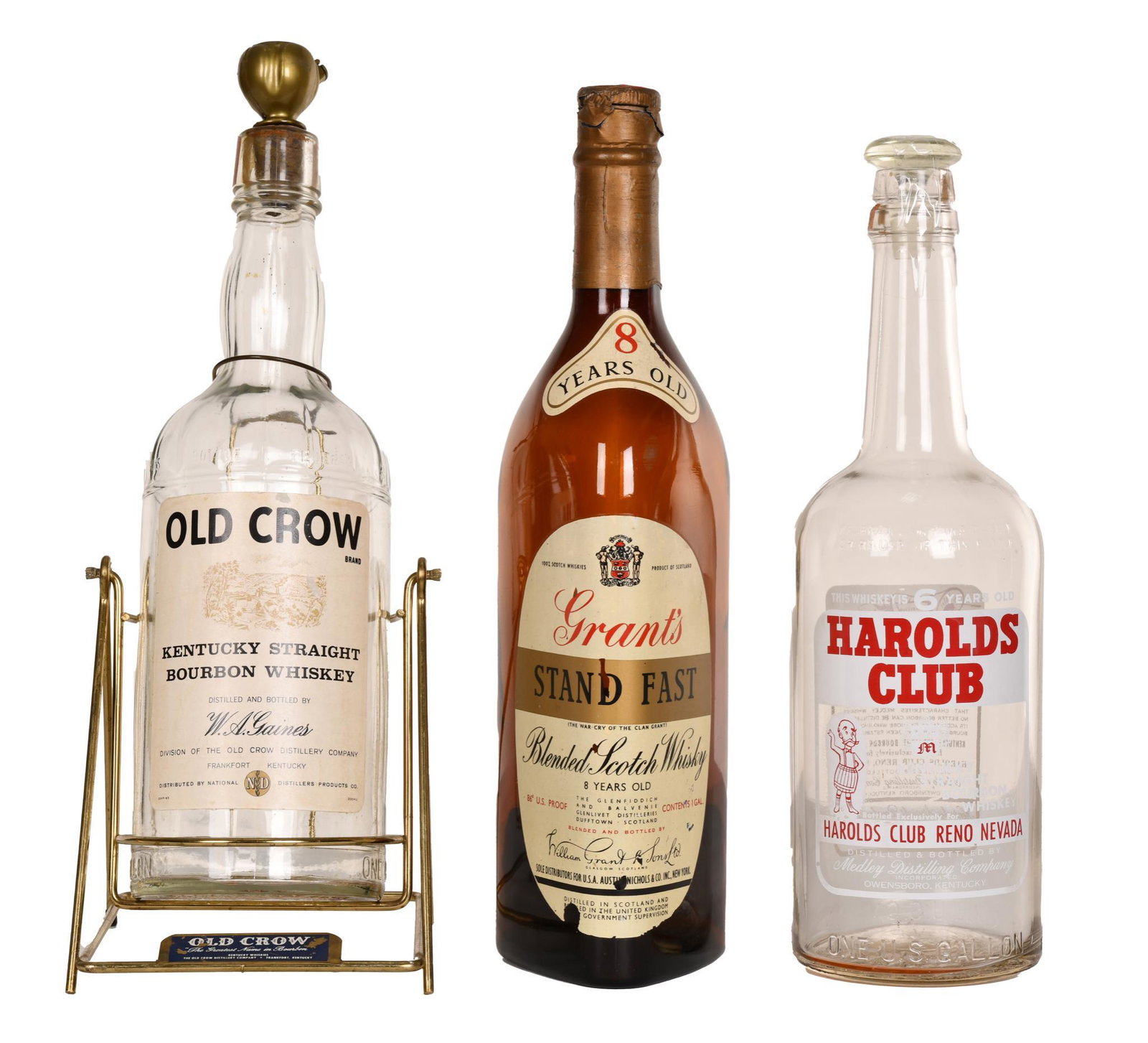 3-Liquor Display Bottles: All in good condition, 20" tall or less in size. Old Crow sitting in cradle for pouring.