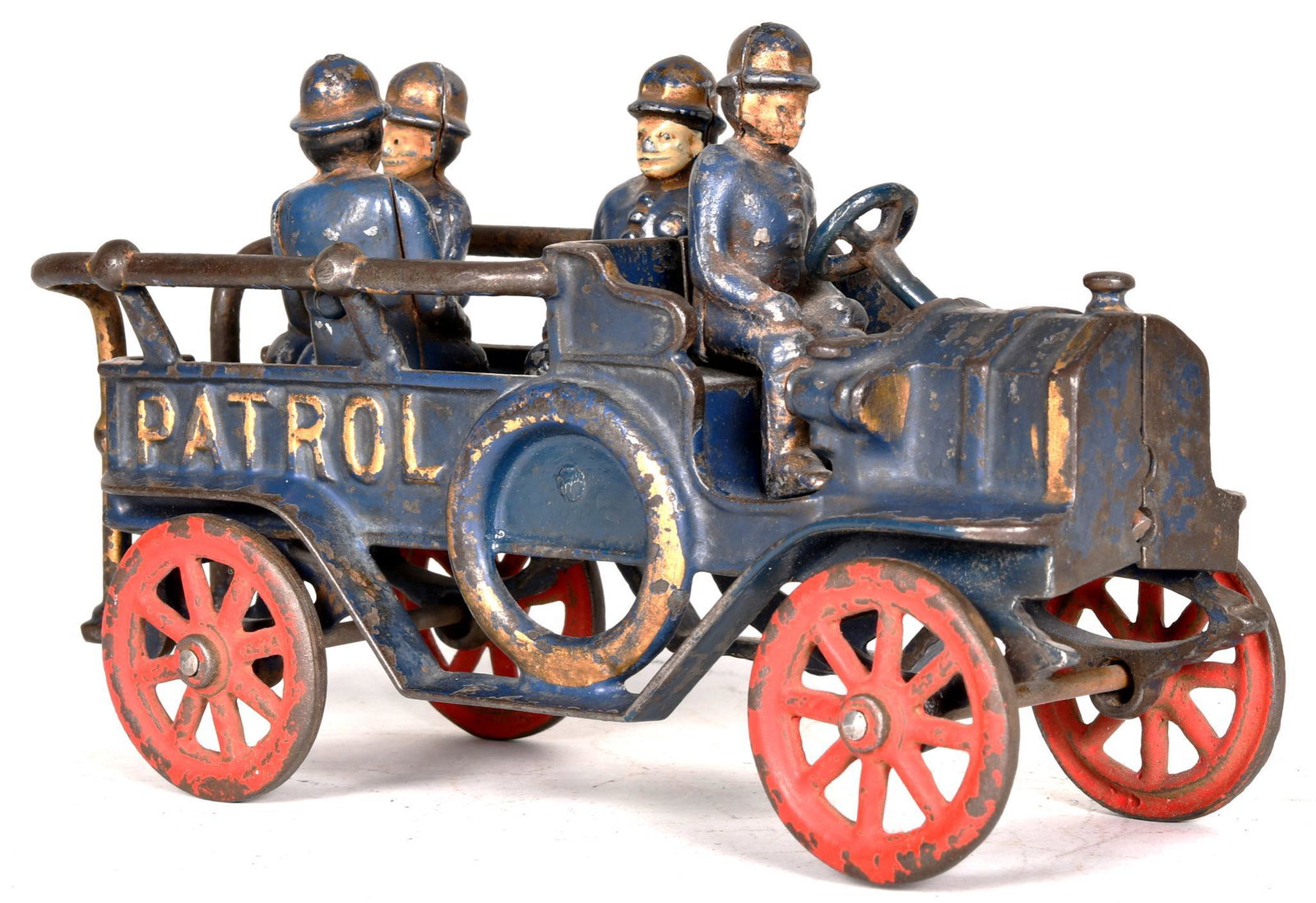 Kenton Cast Iron "Patrol" Truck: Has 70% of its original paint, has wear, dust staining, and paint chips, steering wheel is metal but replaced, cops are new and lead, 9"L., rated 7