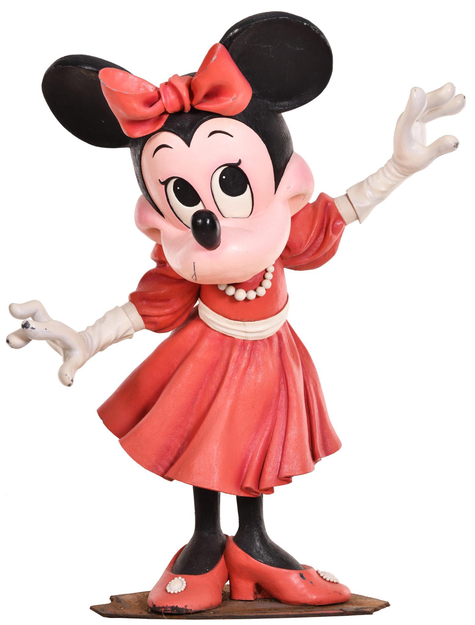 Life Size Minnie Mouse Statue in a Dress: Originally displayed on the marquee of the Disney Store on 5th Ave. in New York. Made of a heavy fiberglass or composite material, has good color, shows minor wear on the high points, mounted on a hea