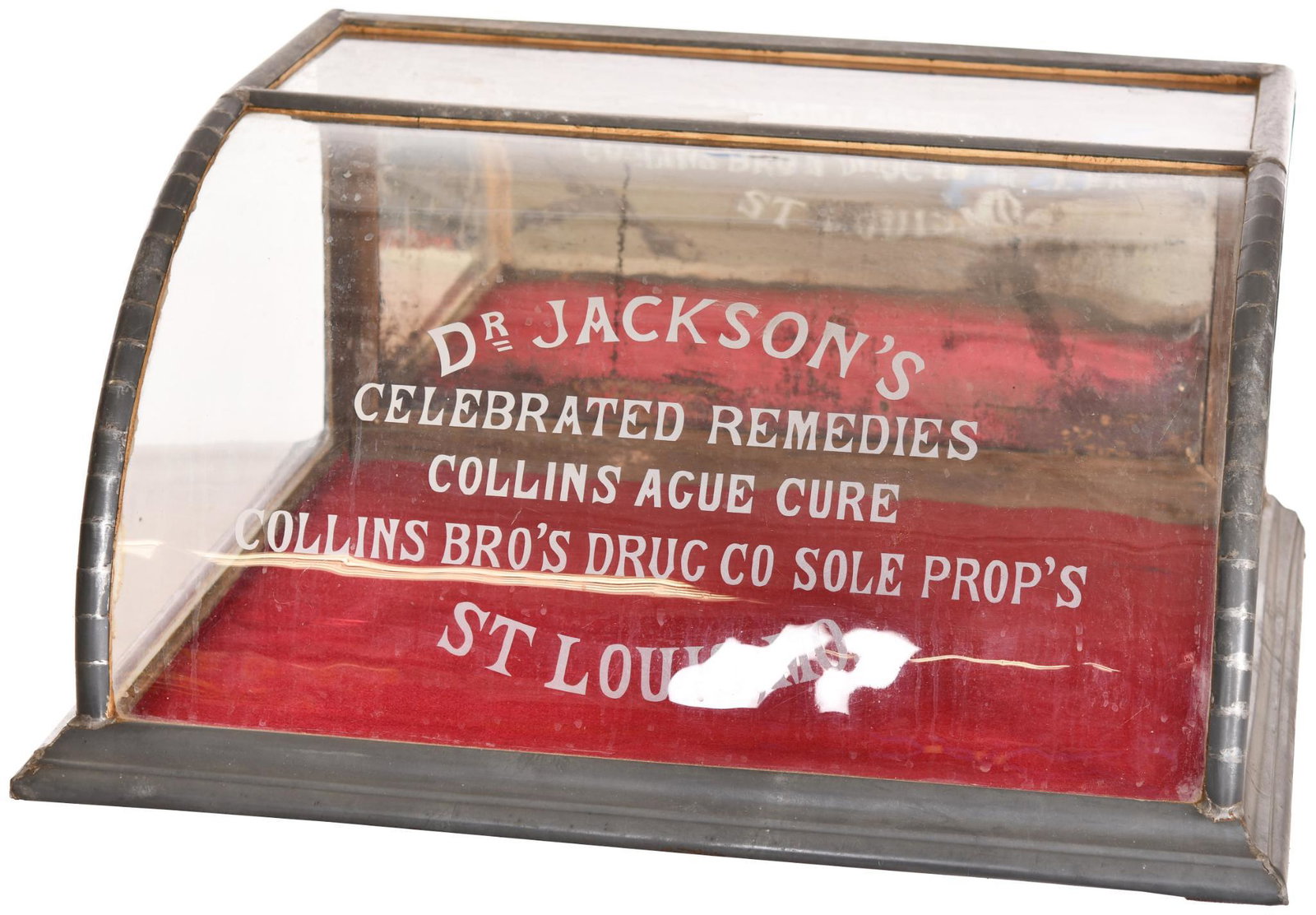Dr. Jackson's Curved Front Display Case: Has a great original look. The curved glass is etched and the the door on the revers is mirrored. It shows light wear and areas of discoloration throughout. The structure is covered with metal but it 