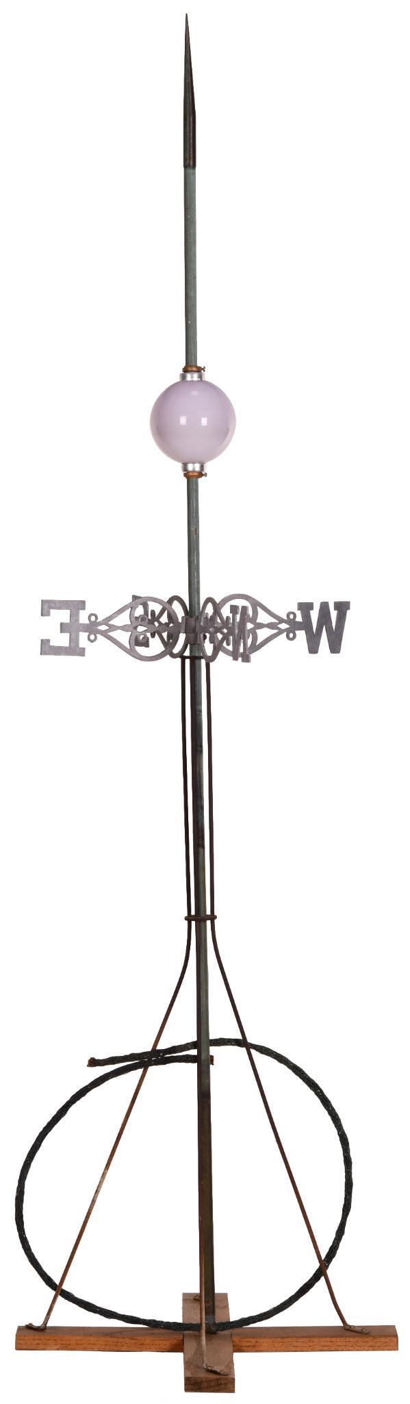 Lightning Rod With Ball & Direstional: The ball looks like a very light amethyst colored milk glass. The directional is cast aluminum. It displays well. 69.5"x17.5". Overall good condition with a odd colored ball.