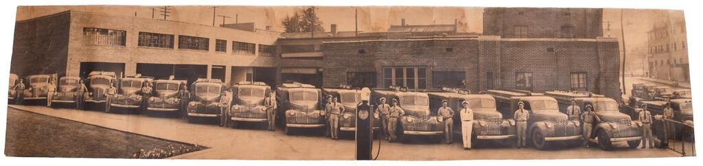 1942 Coca-Cola Paper Poster With Trucks: Single sided paper that has been linen backed. It has a great image of a bottling facility in Kentucky. It shows areas of discoloration, wear, fold marks, and some tears. It displays well and would lo