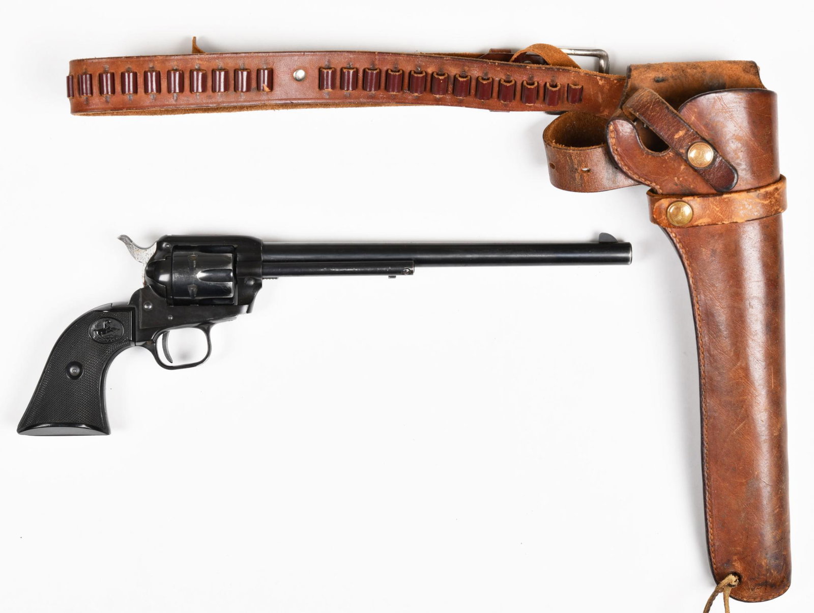 Colt Single Action Buntline Scout .22LR Revolver: 9.5" barrel. Comes with Hunter leather holster and belt. 75% blue with handling marks. Has holster wear but functions very well.