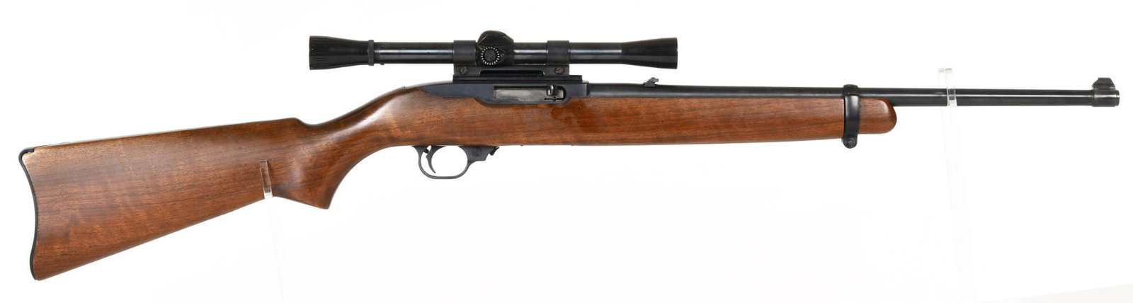 Ruger 10/22 Carbine Semi Automatic .22 Caliber Rifle: 18.5" barrel. 90% blue. Shows handling marks on the stock. Comes with weaver C6 rim-fire scope.