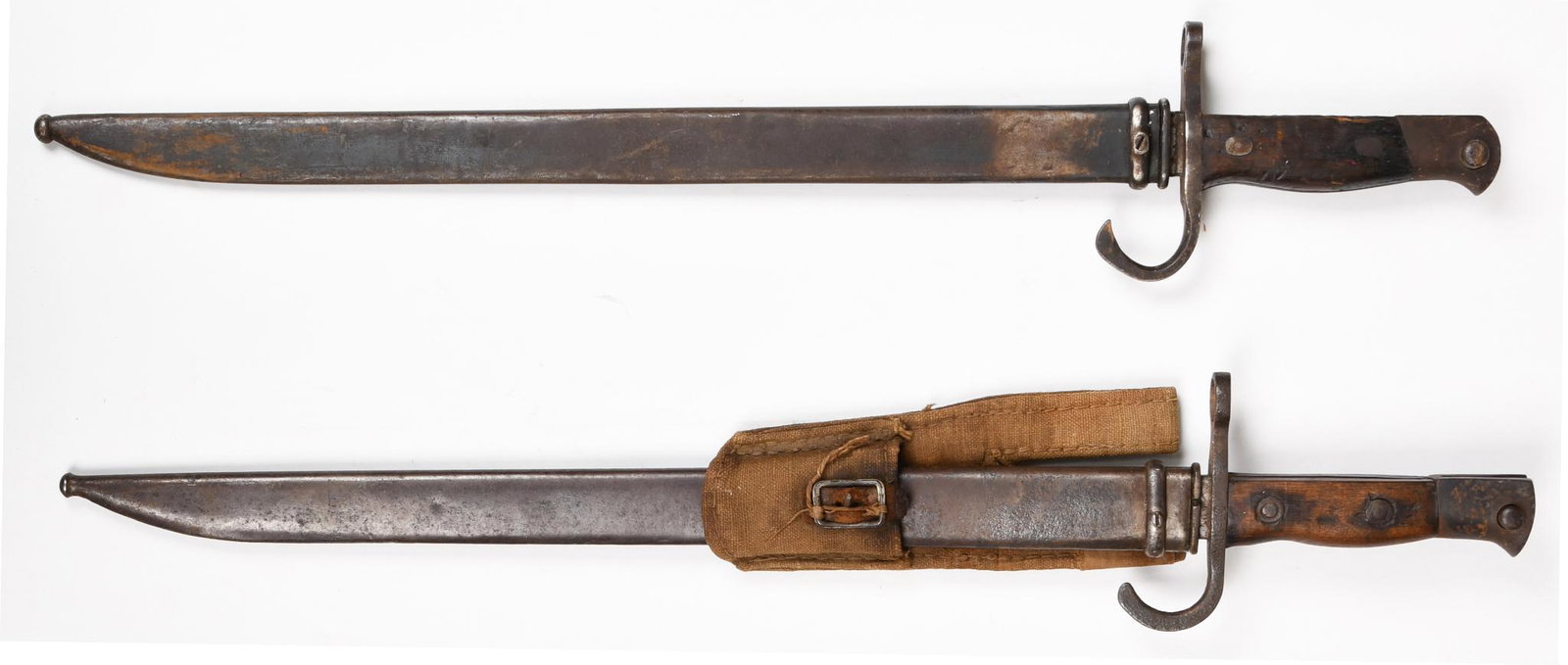Lot of 2 Japanese Type 38 Arisaka Bayonets: 16" blades. One has Tokyo Arsenal mark and the other is unmarked. Both show wear and heavy handling marks.