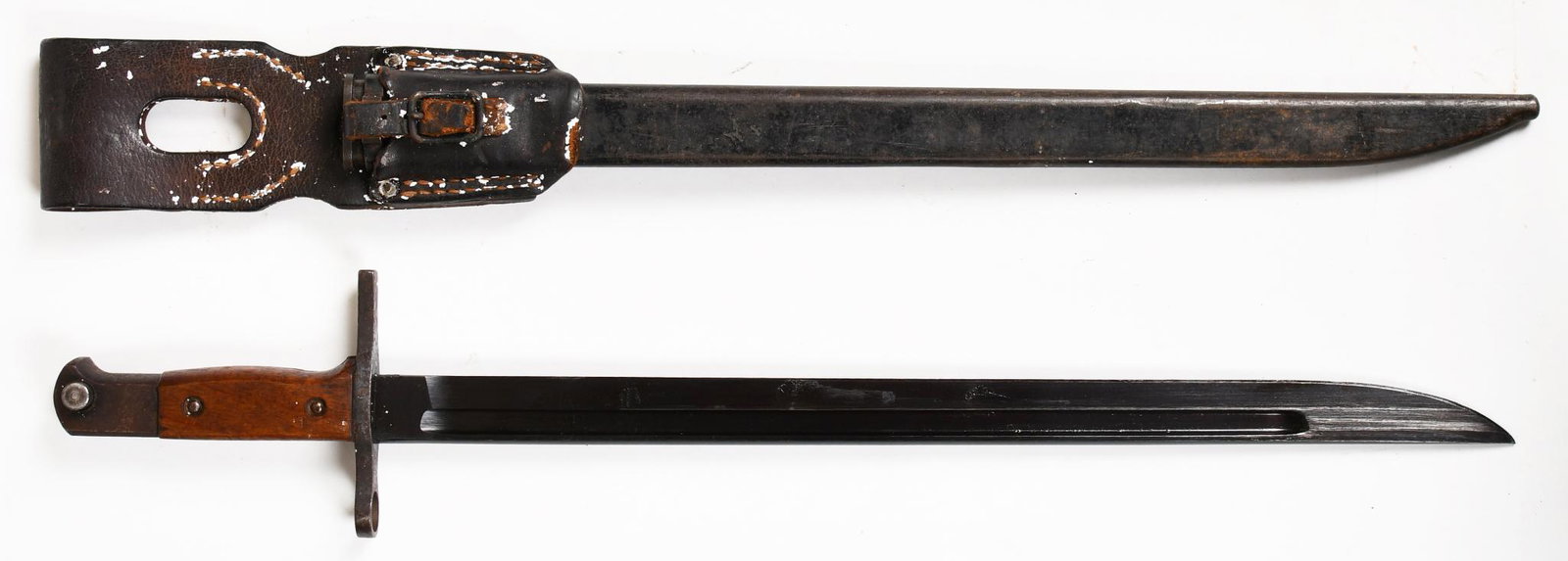 WWII Japanese Type 38 Bayonet With Scabbard: 16" blade. Has Tokyo or Kokura proof mark depending on year. Blade is in good shape with minor wear. Handle and scabbard are in great original condition with wear and paint loss throughout.