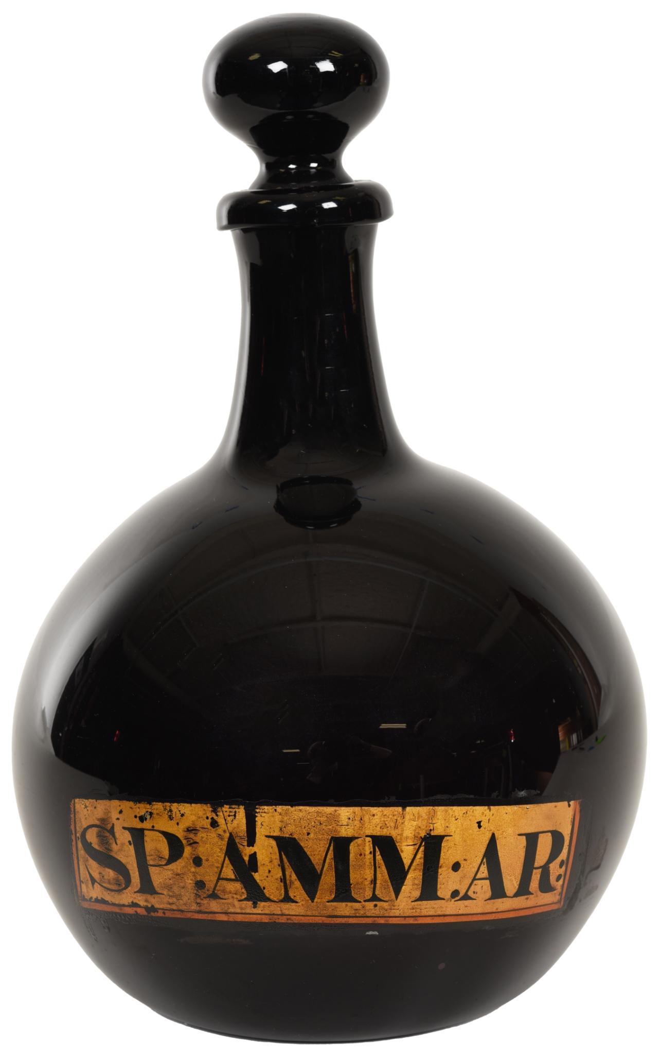 Early 19th Century Bulbous Deep Amethyst Apothecary Jar: Hand blown jar and stopper, ground pontils both are in excellent condition, has the label, displays well, SP:Amm"AR, 13.5"T., rate 9