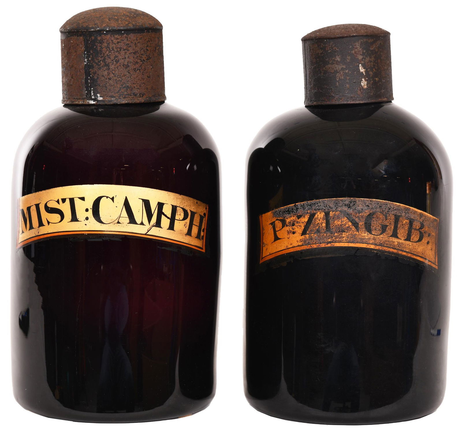 2-Early 19th Century Deep Amethyst Apothecary Jars: Hand blown jar and stopper, ground pontils both are in excellent condition, has the label, Camph & Zingib, displays well, 13.5"T., rate 9