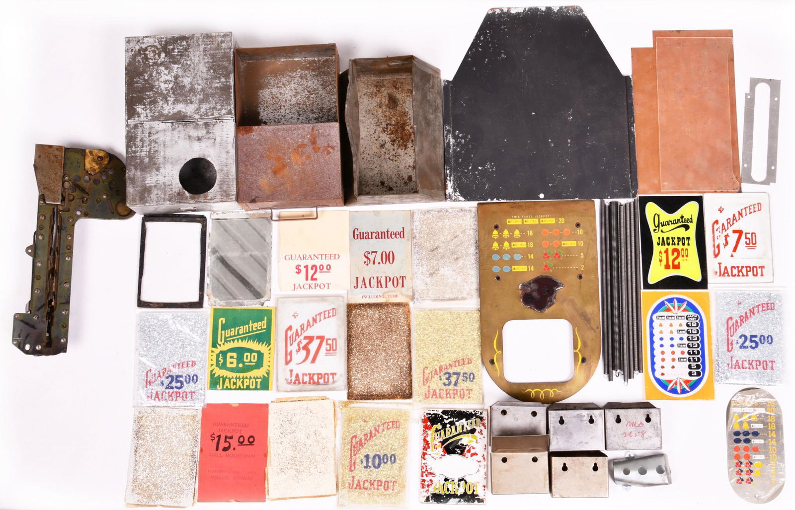 Lot Of Miscellaneous Slot Machine Parts: Coin boxes, Escalators, and much more. Various conditions. Some parts are missing pieces. 11.5"x11" or less in size