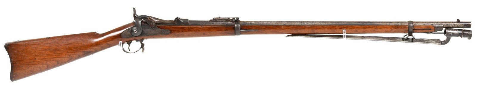 Antique Springfield 1884 45-70 Single Shot Trapdoor: Stock is cartouched 1886, and is aimsworth inspected. Bore has significant corrosion, but has shootable lands and grooves. Comes with period bayonet. Stock has a little bit of mildew, but is in better