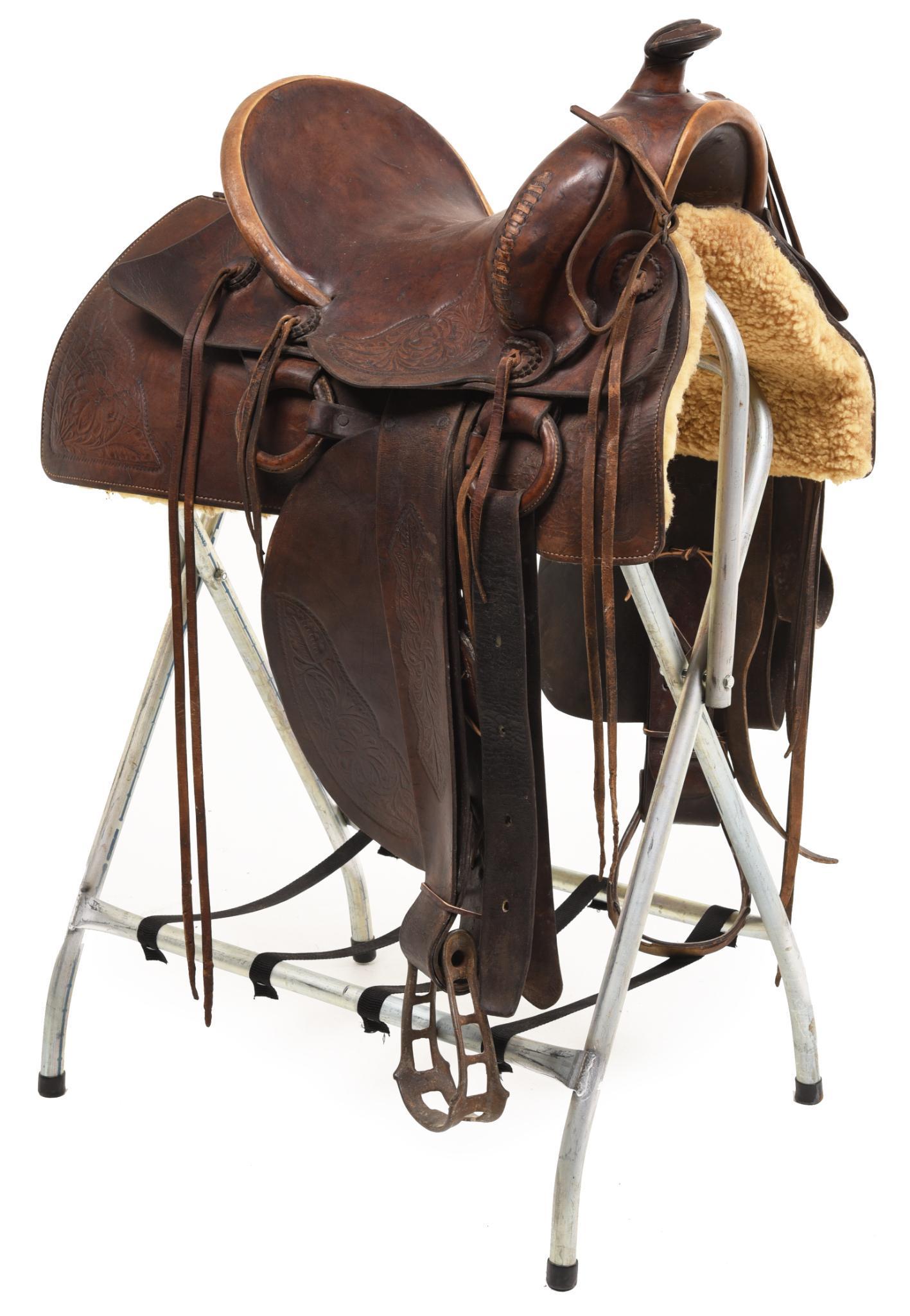 Circa 1910 Saddle With Period Cast Iron Stirrups: 13" with period cast iron stirrups. Good condition.
