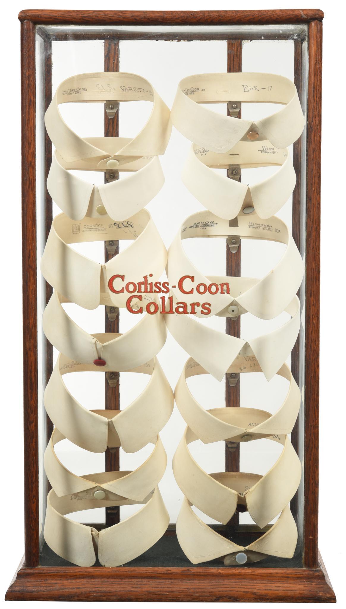 Corliss-Coon Collars Oak Counter-Top Display: The oak cabinet is in very good condition, has original decal on the front glass, full of collars, 25.5"x14.5"x8.5", rated 8.5