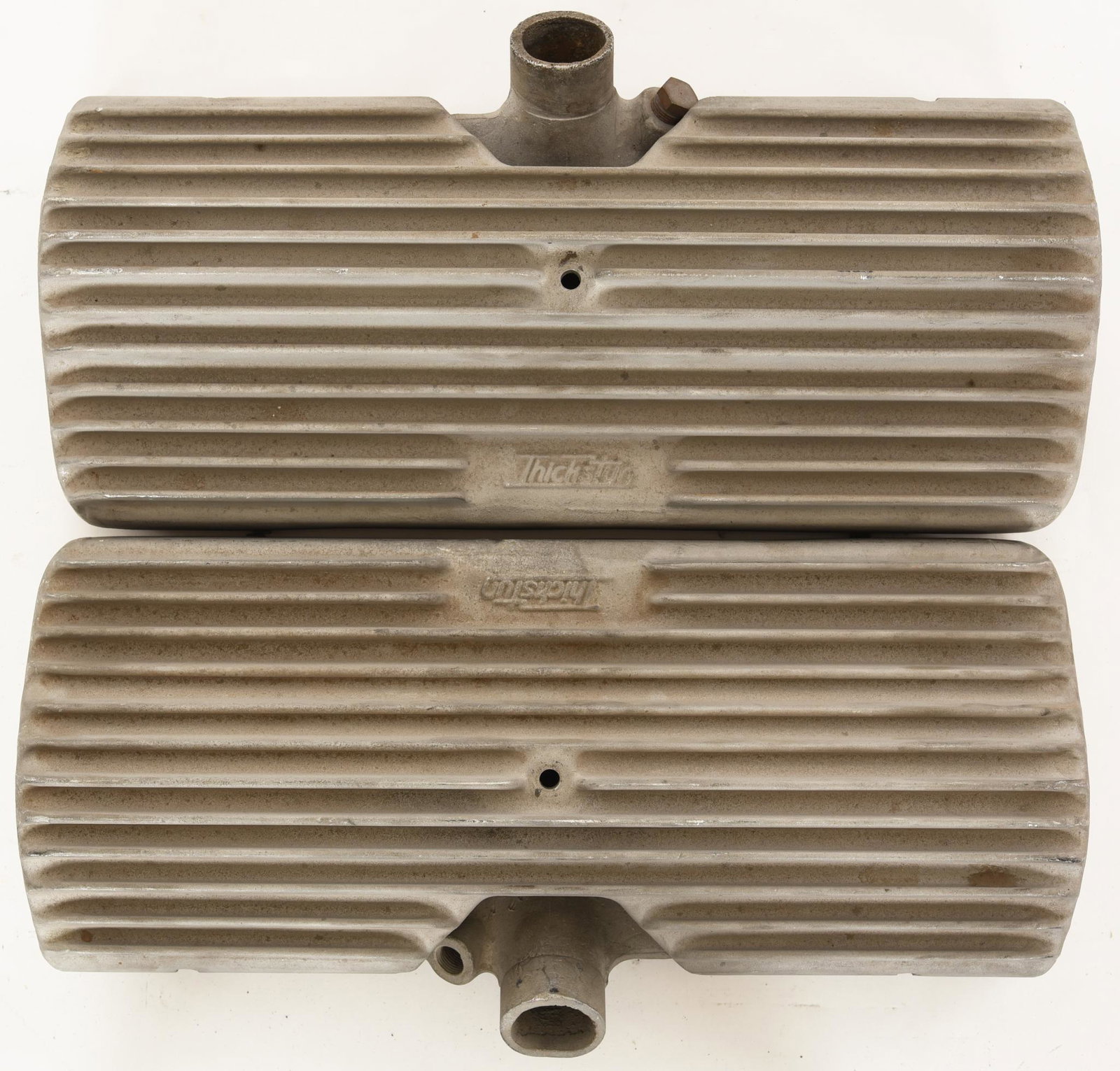 Thickstun Heads With Rare Finned Covers: 24 stud. Show minor wear thoughout. A little dirty but will clean up very nice. One head has a soft putty in two of the spark plug holes. No noted cracks or repairs. The covers are in very good condit