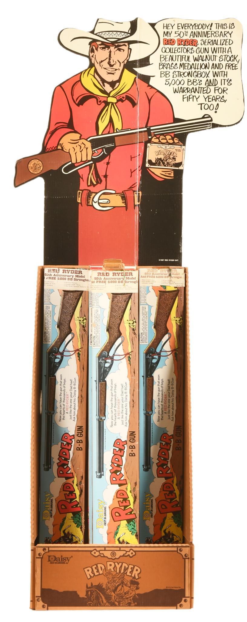 Daisy Red Ryder Store Display: Marked 1987. Was never used. Shows some wear and a few creases. Has good color. Comes with 4 Daisy Red Riders in original boxes. The boxes shows some wear and one has a rip on the end. Has original in
