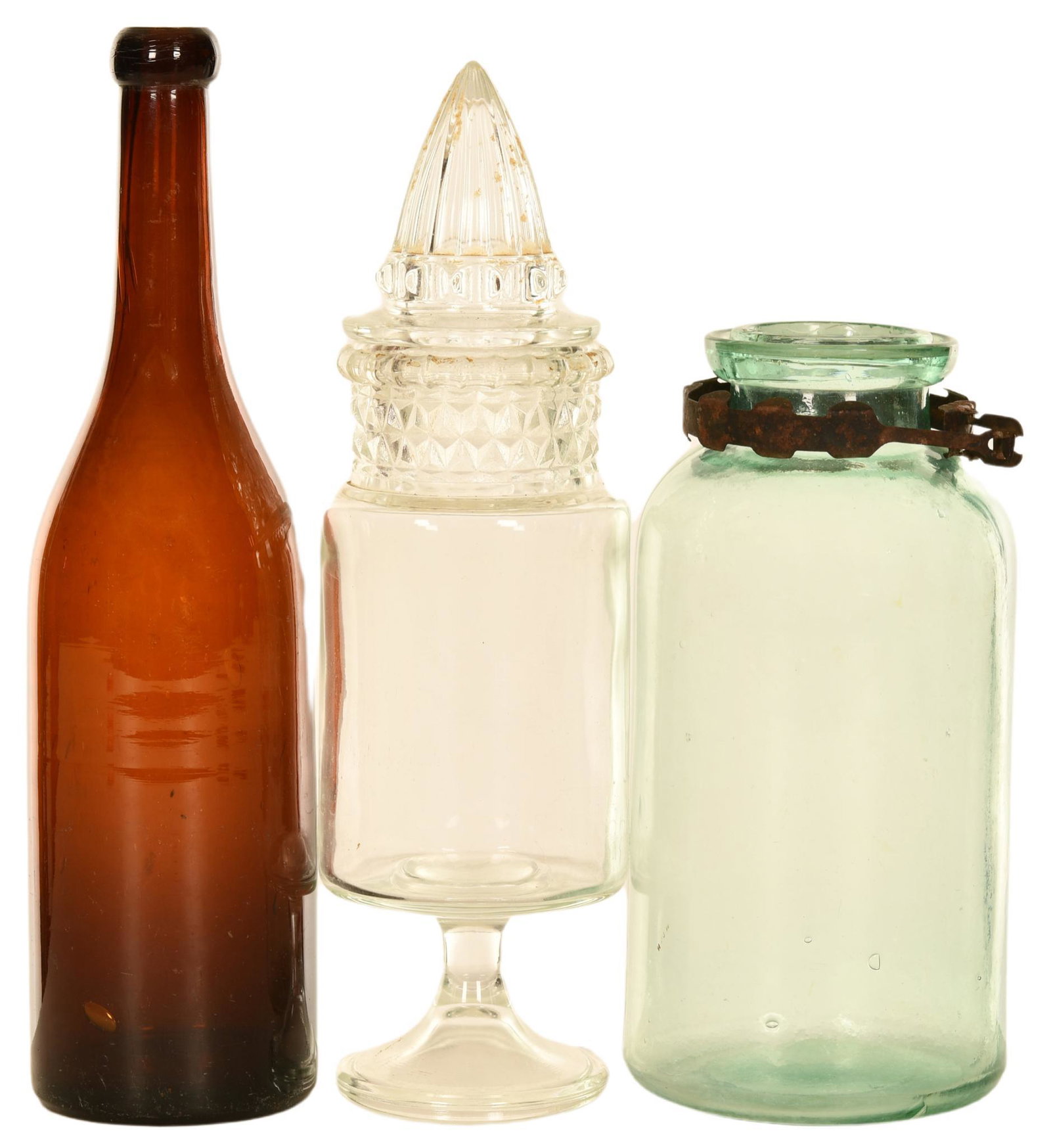 Lot Of 3 Jars & Bottles: The amber wine style bottle is not marked and has a few chips at the top, green wide mouth bottle is marked with a "K" on the bottom, the pointed candy jar is also not marked, they display well, 12", 