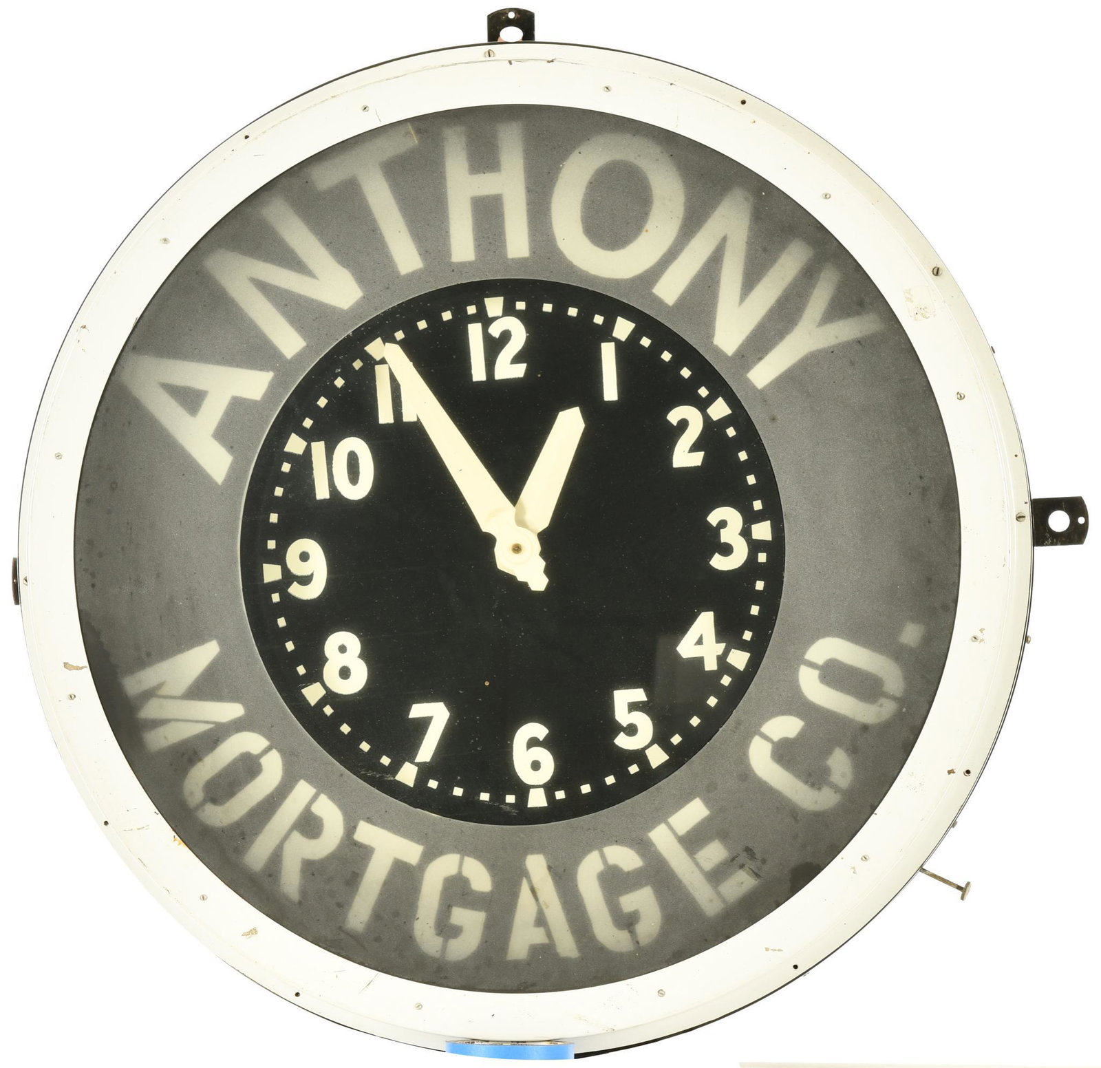 Anthony Mortgage Co. Neon Clock: Lights up and appears to keep time, Glo-Dial, front glass is frosted, case is original paint with original decal and tags, shows wear and paint loss throughout, 32", rated 8.25