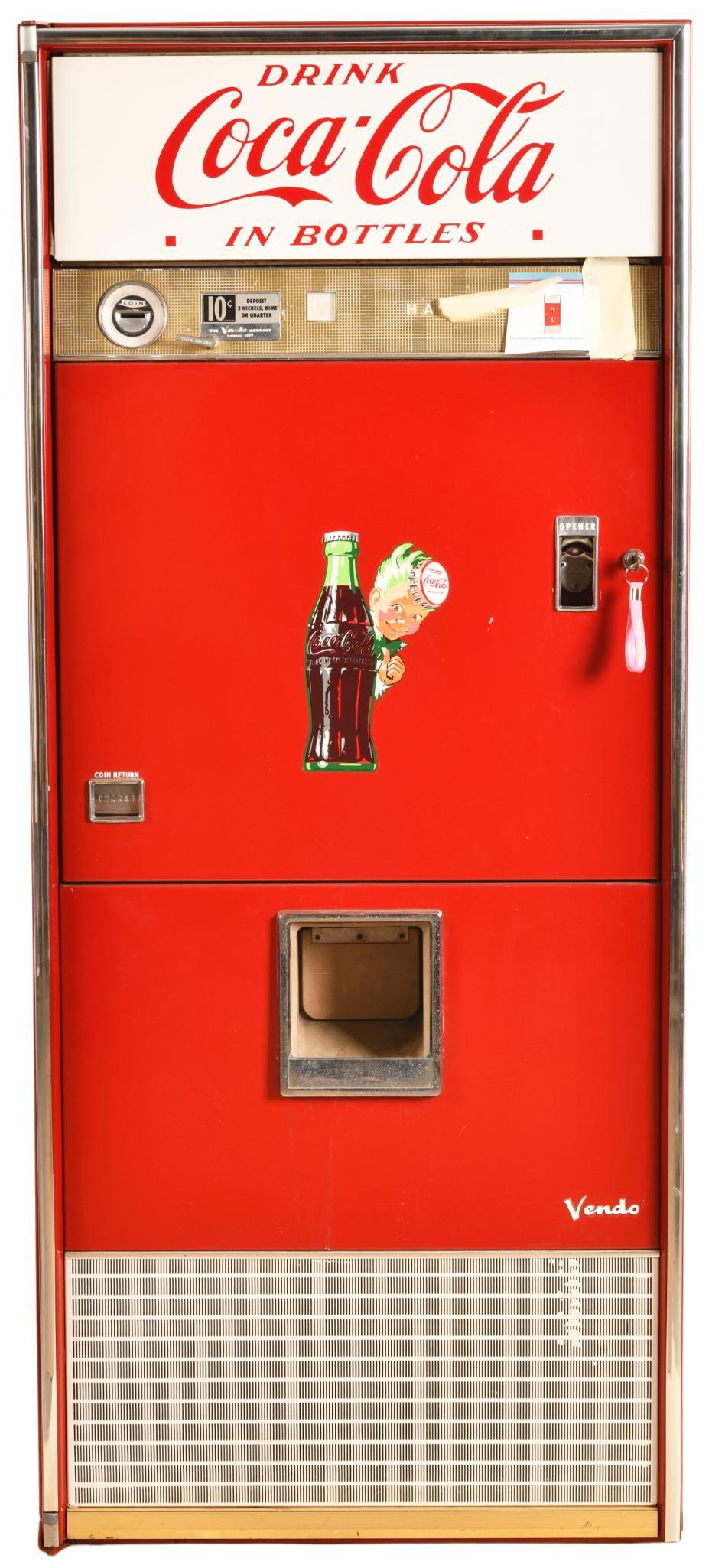 Coca Cola Vendo Model #92B Coin Op Soda Machine: Has been professionally restored, missing the coin slide from the coin slot to the coin box, has key, works and lights up, shows light wear, 65"x28"x22", rated 8.75 restored