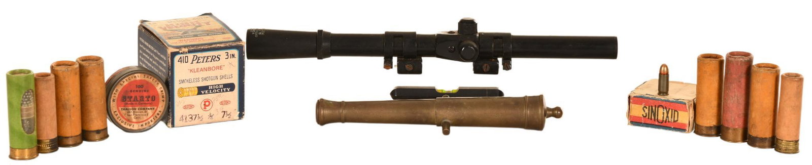 Lot of Early Shooting Related Items: Includes a small table top cannon barrel, a vintage box of Peters .410 gauge shotgun shells approximately 1/4 full, small tin of starter pistol crimped blanks, vintage box nearly full of what appears