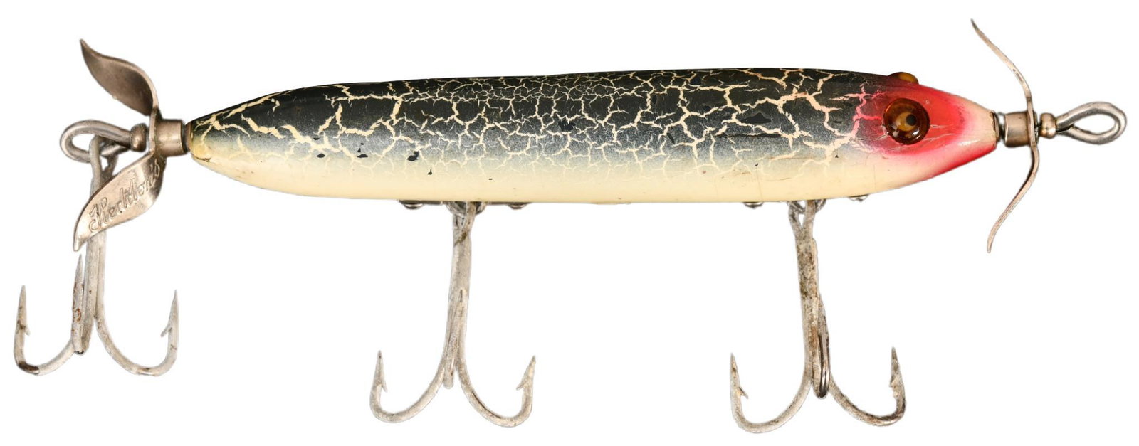 Heddon 130 Crackle Back Torpedo: Coming in one of Heddon's prettiest colors, Fine Sienna Green Crackle Back with white belly and red eye blush. Rigged with scarce bar rig hardware, glass eyes and Heddon marked props. Condition on thi