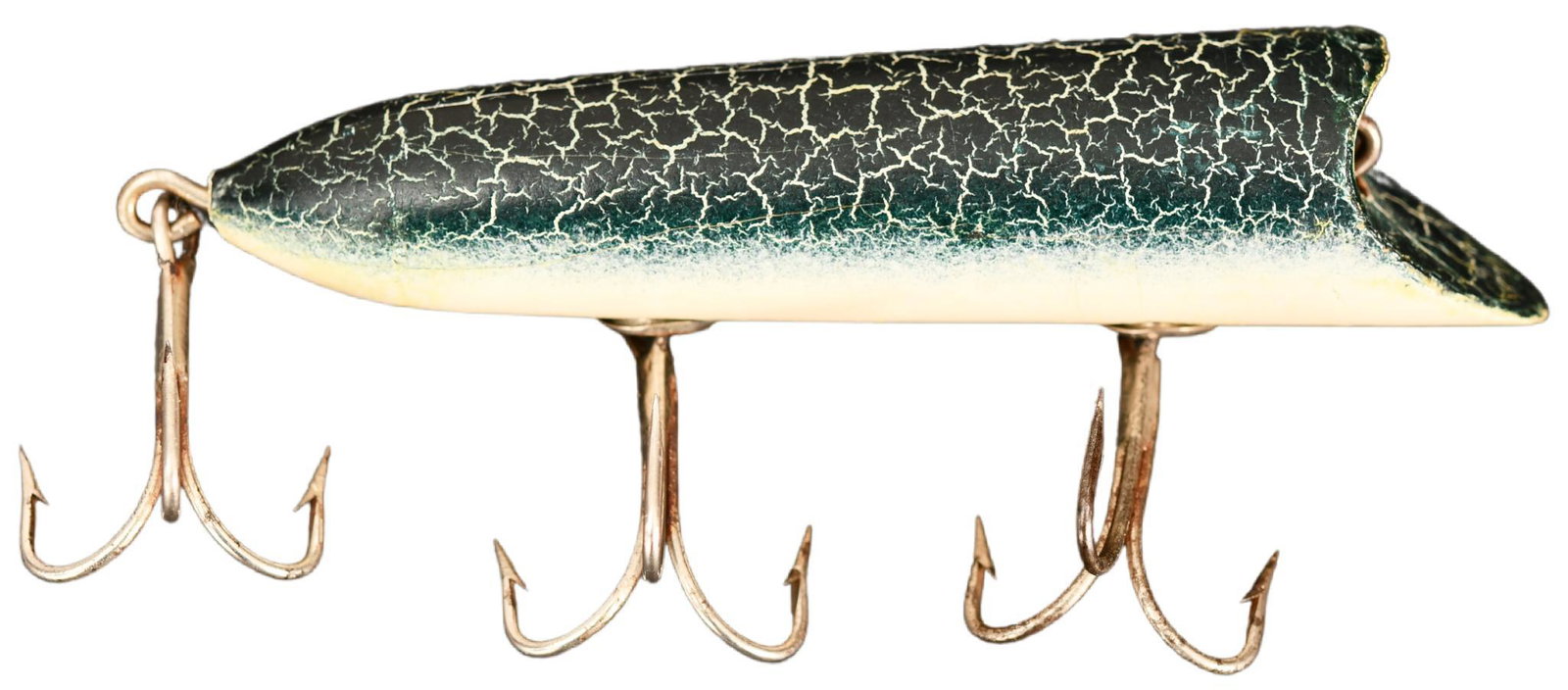Unusual Heddon 3-hook Early Lucky 13 Crackle Back: Very early Heddon cup rigged Lucky 13 lure with tapered back in tough Green Crackle Back finish. Three hook configuration and no eyed model. Very early vintage and grading near excellent in condition.