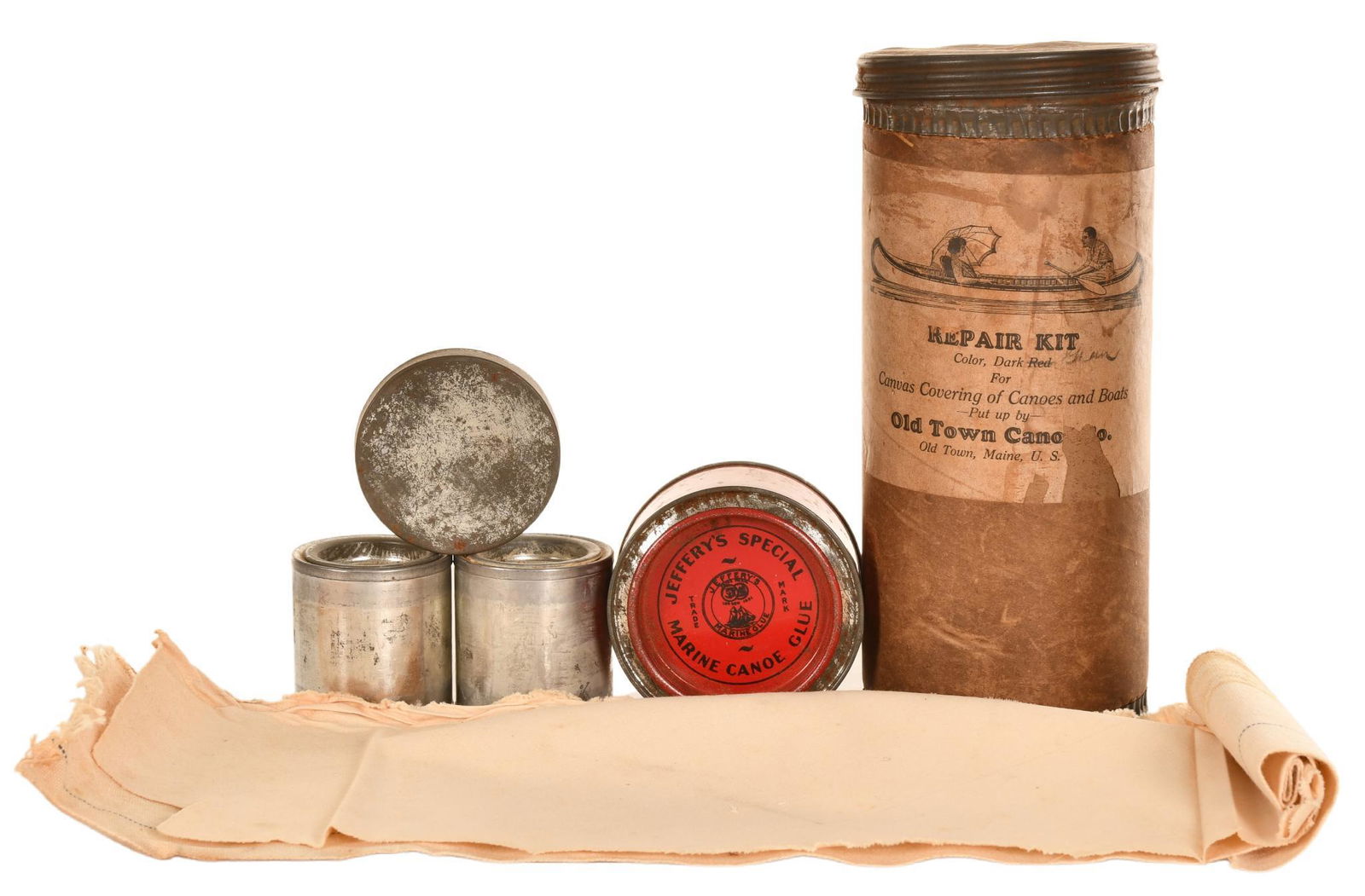 Old Town Canoe Co. Canoe Repair Kit: Composite construction with tin top, lid, and bottom, full of original contents, great paper advertising label with canoe graphic, has average color, shows wear, paper loss, staining, and discoloratio