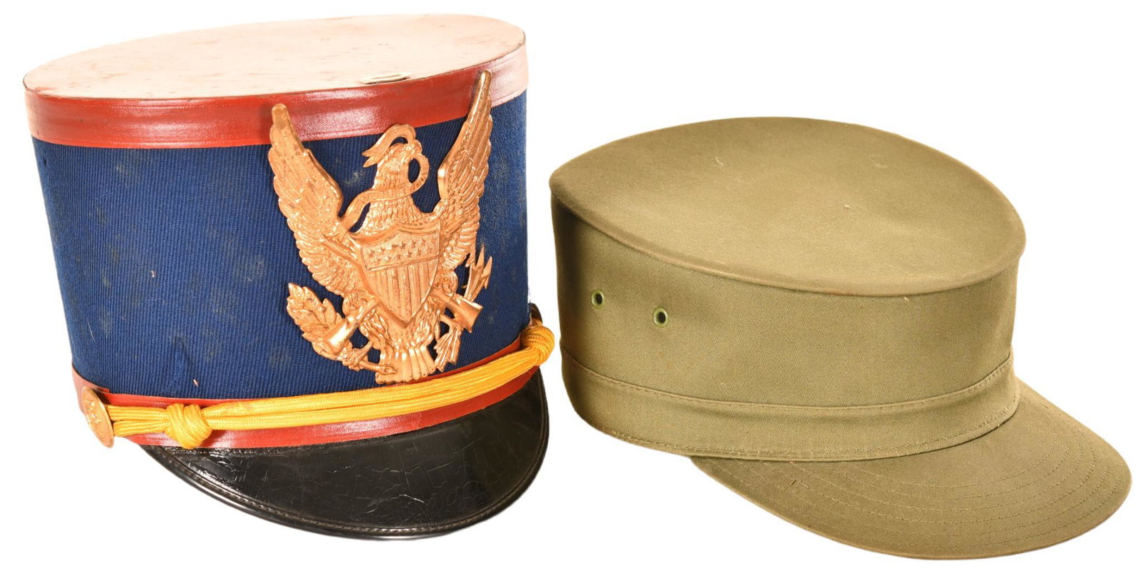 Lot of 2 Military Style Hats: 1 olive drab army style cap, N9509 stamped on inside of cap, 7.5"x10"x4", shows wear and discoloration but in overall above average to good condition, 1 blue and red marching band style cap, marked Ro