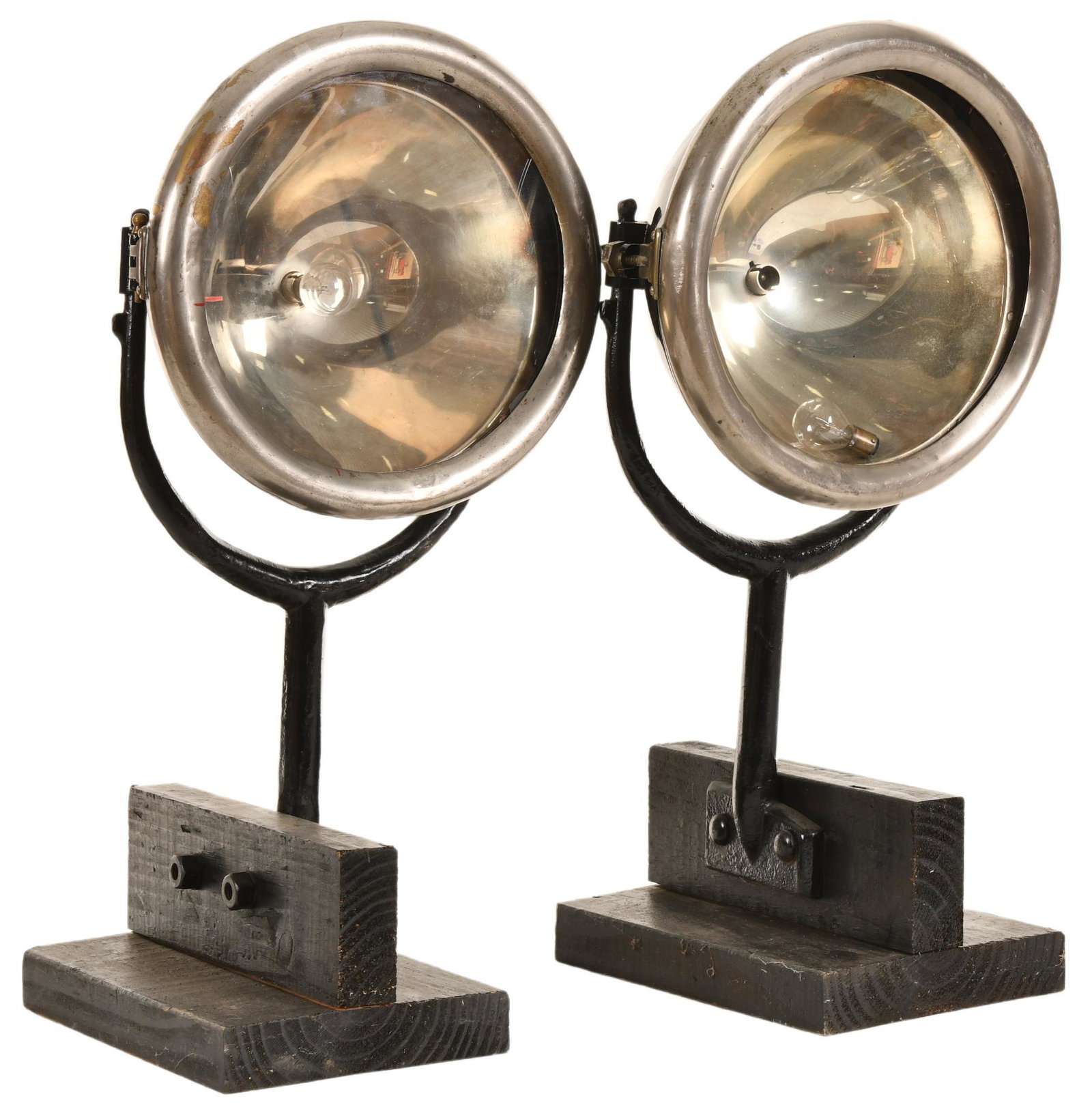 Lot of 2 Early Headlights: On swivel mounts mounted to wood, appears to be repainted, small crack in one lens, show some wear but are in very good condition, displays very well