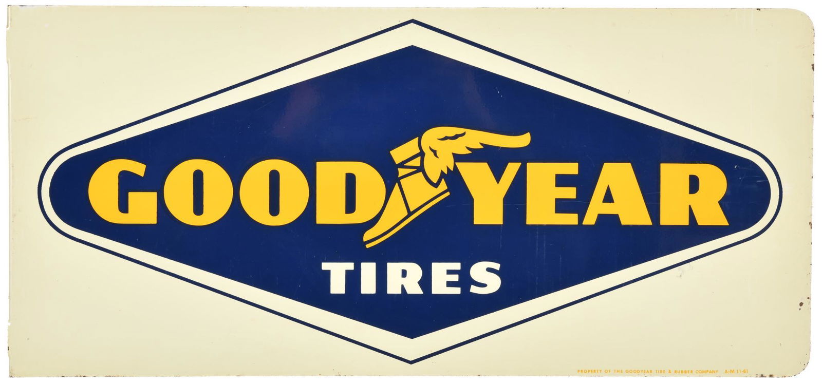 Goodyear Tires Flange Sign: DSTF, has good color and gloss, shows light wear, slight discoloration, and minor paint loss, marked A-M 11-61, displays very well, 12"x26", rated 8.5 & 8.25