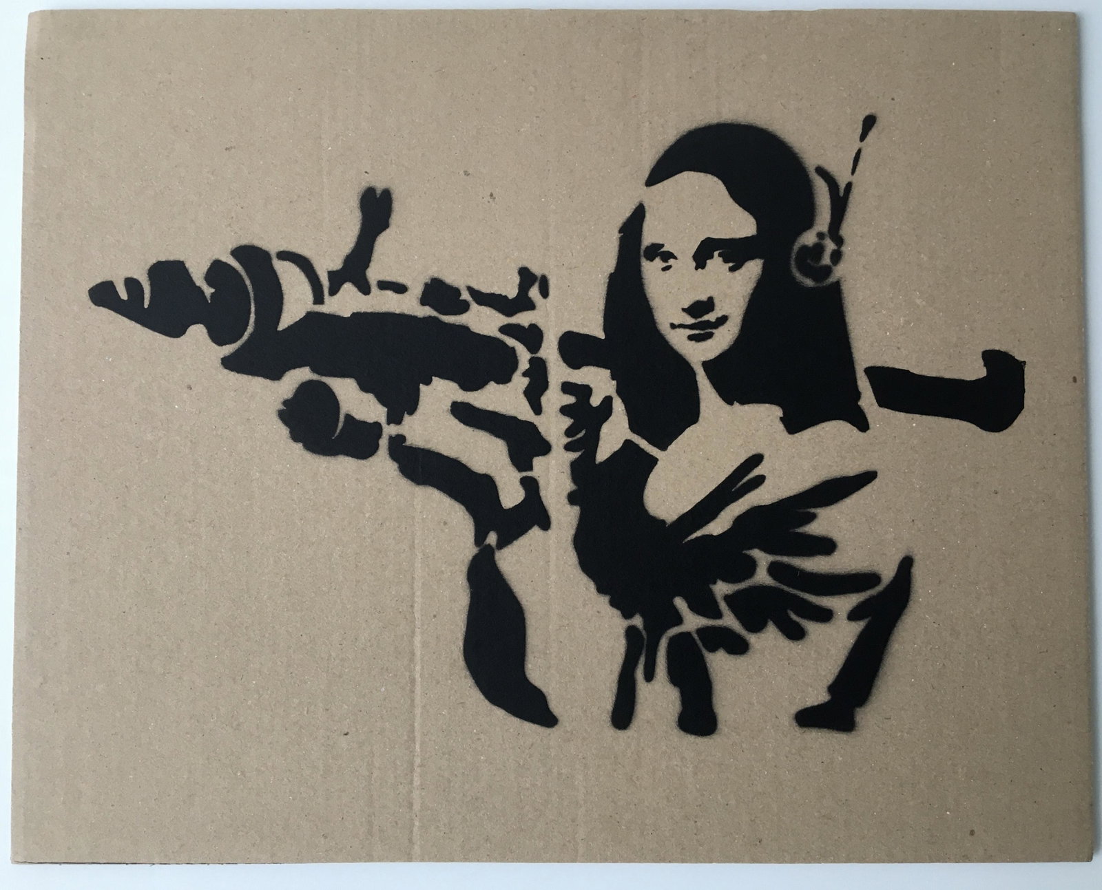 BANKSY GRAFITTI SPRAY PAINT ON CARDBOARD: AFTER BANKSY GRAFITTI SPRAY PAINT ON CARDBOARD. 29.5 X 23.5 cm. Sold Unframed.