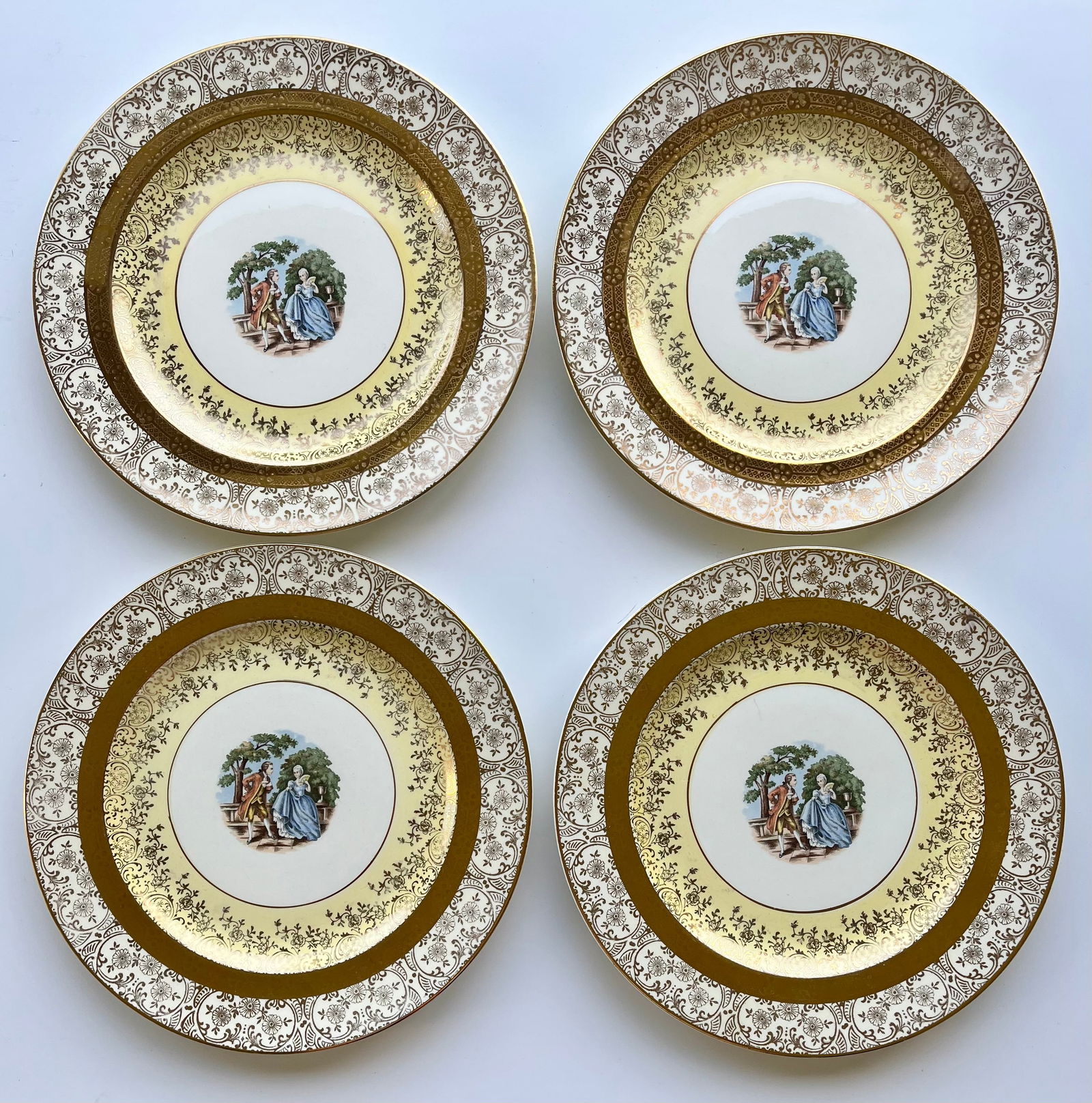 Victorian Style Bromley Plates Set of 4 –22K Gold Trim,Courting Couple Scene 10in: Set of 4 vintage Bromley decorative plates featuring a romantic courting couple scene in the center. Elegant ornate border with rich 22K gold trim. Marked on back: “Brumley – Decorated – 22