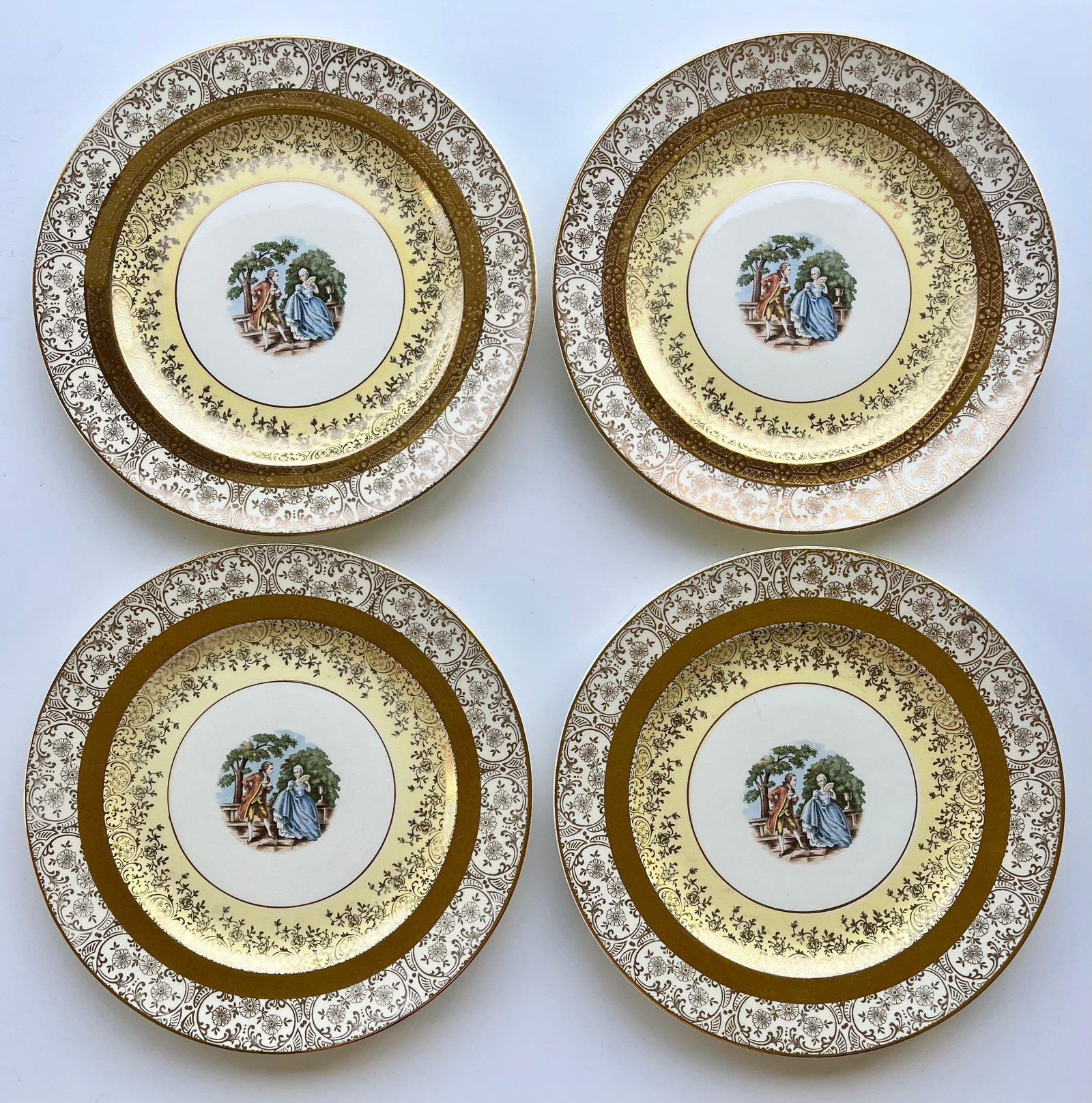 Victorian Style Bromley Plates Set of 4 –22K Gold Trim,Courting Couple Scene 10in: Set of 4 vintage Bromley decorative plates featuring a romantic courting couple scene in the center. Elegant ornate border with rich 22K gold trim. Marked on back: “Brumley – Decorated – 22 Kara